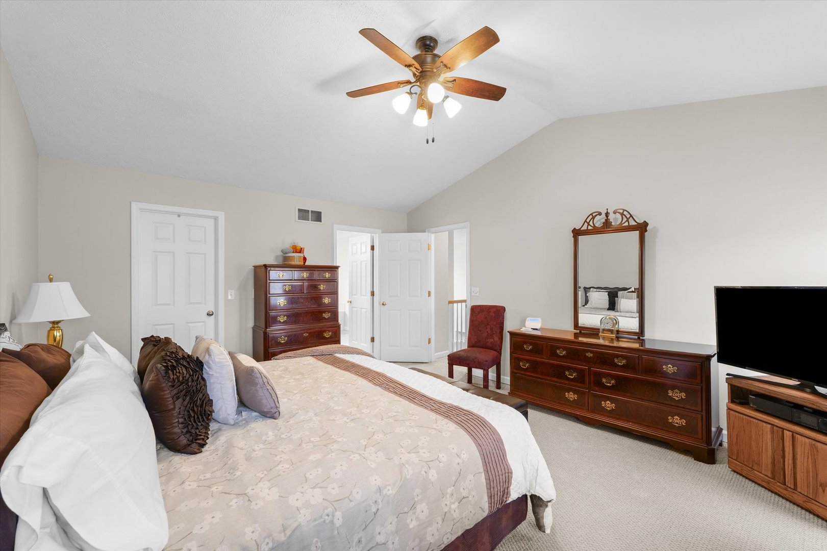 3908 Turnberry Drive Champaign, IL 61822 - Photo 26 of 49 a bedroom with a bed and a flat tv screen on dresser