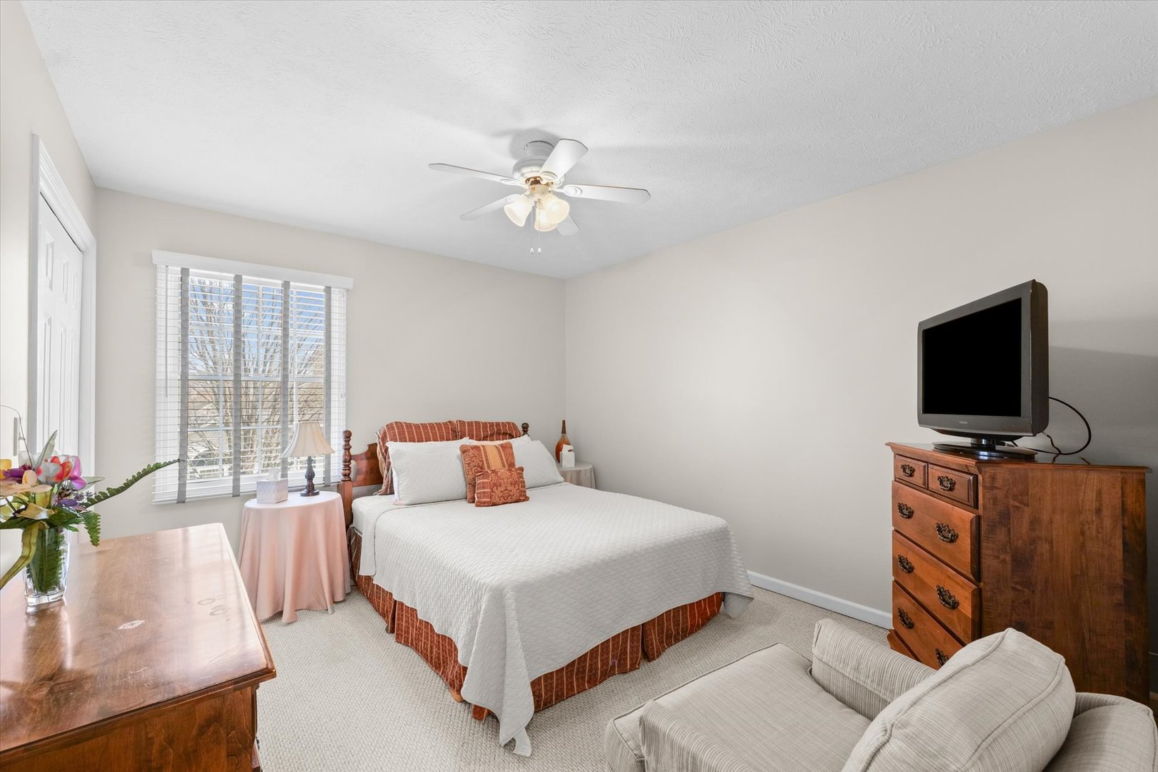 3908 Turnberry Drive Champaign, IL 61822 - Photo 30 of 49 a bedroom with a bed and a flat screen tv