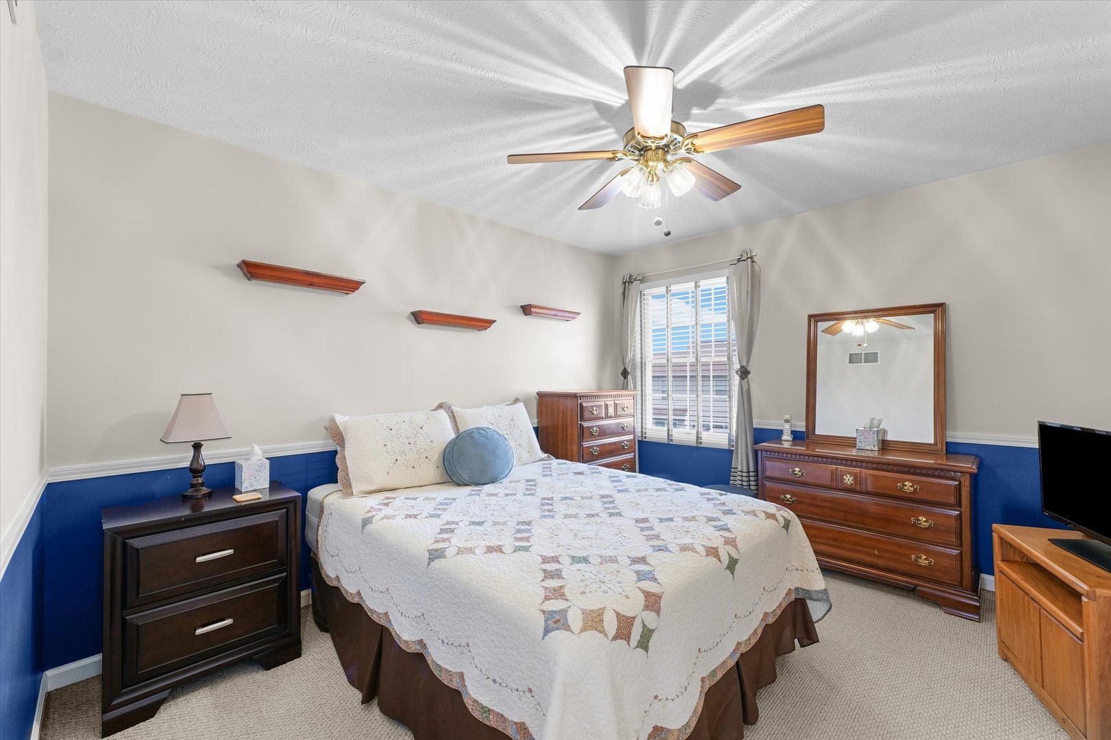 3908 Turnberry Drive Champaign, IL 61822 - Photo 32 of 49 a bedroom with a bed and a chandelier