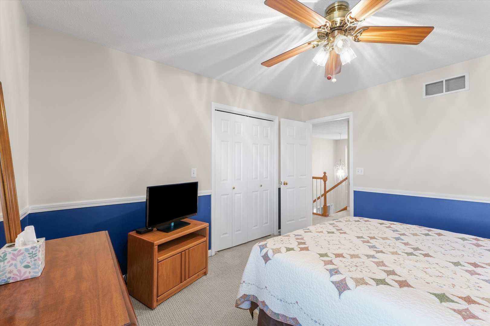 3908 Turnberry Drive Champaign, IL 61822 - Photo 33 of 49 a bedroom with a bed and a flat screen tv