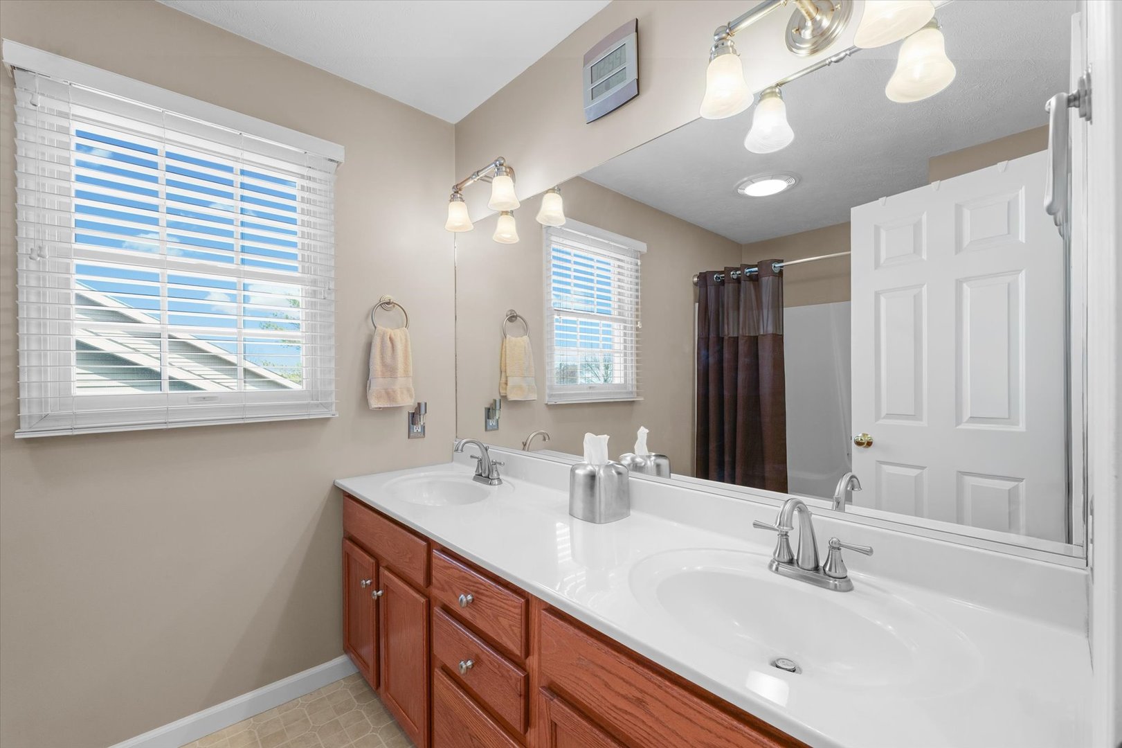 3908 Turnberry Drive Champaign, IL 61822 - Photo 36 of 49 a bathroom with a double vanity sink and a mirror