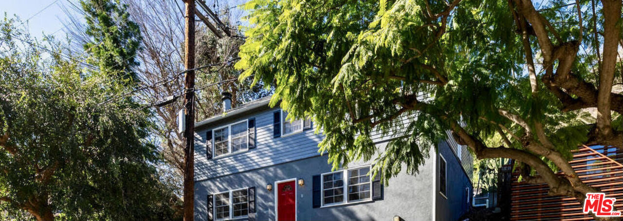 a view of houses with tree s