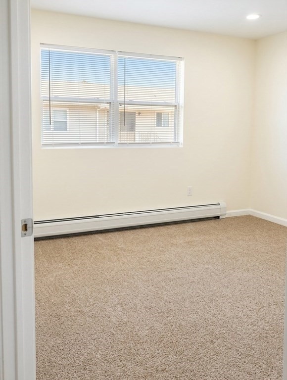 361 Hildreth Street, Unit 24 Lowell, MA 01850 - Photo 4 of 9 an empty room with a window