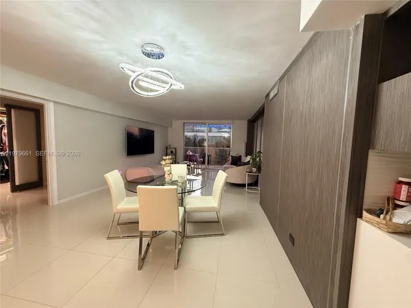 a view of a livingroom with furniture and a window