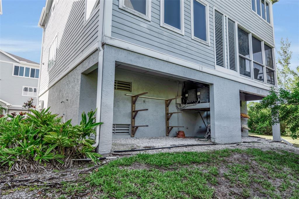 848 Evergreen Way Longboat Key, FL 34228 - Photo 36 of 66 a view of a house with many windows and plants