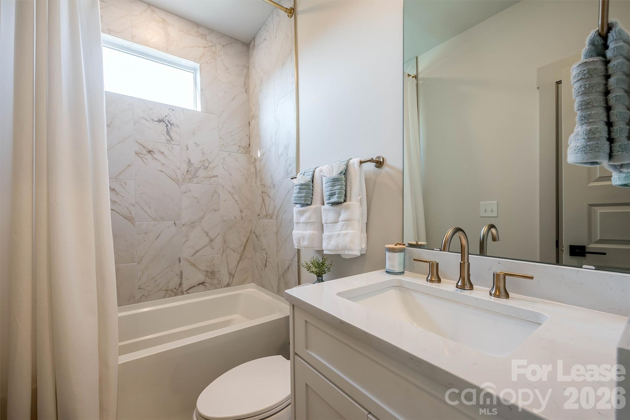 2319 Wesley Village Road Charlotte, NC 28208 - Photo 24 of 44 a bathroom with a granite countertop sink toilet and shower