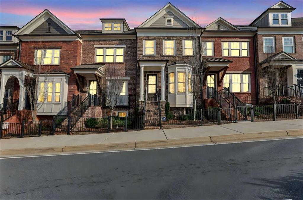 4466 Lemon Street Acworth, GA 30101 - Photo 3 of 65 a front view of a residential apartment building with a yard