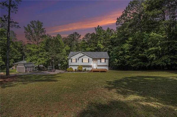a house with river in front of it