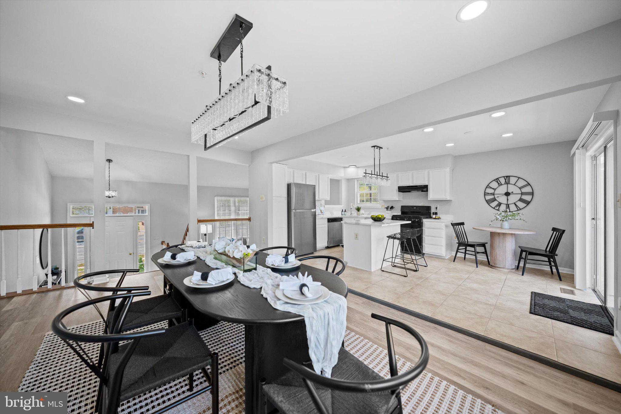 12908 Windbrook Drive Clinton, MD 20735 - Photo 15 of 67 a large kitchen with a table and chairs in it