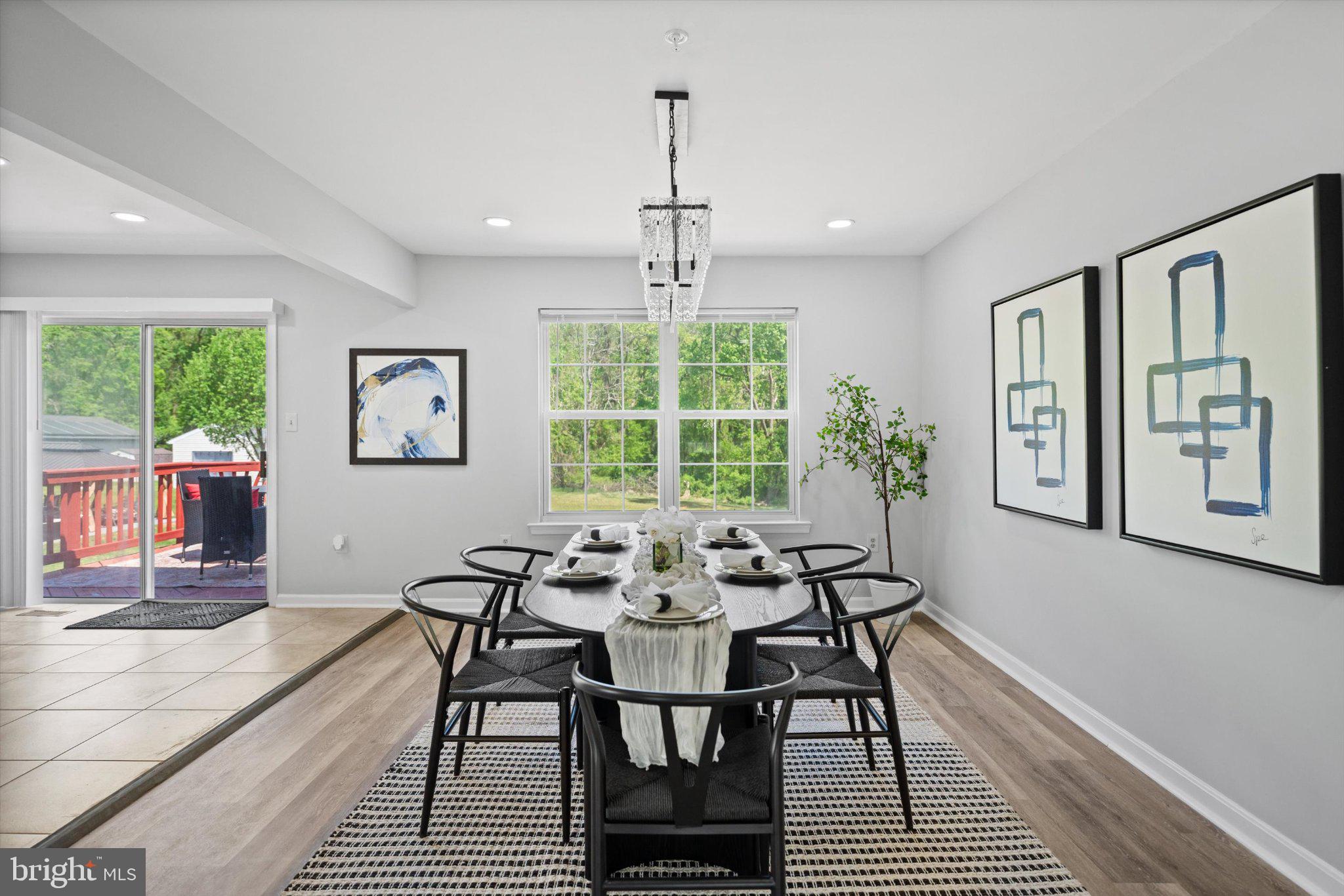 12908 Windbrook Drive Clinton, MD 20735 - Photo 16 of 67 a view of a dining room with furniture window and outside view