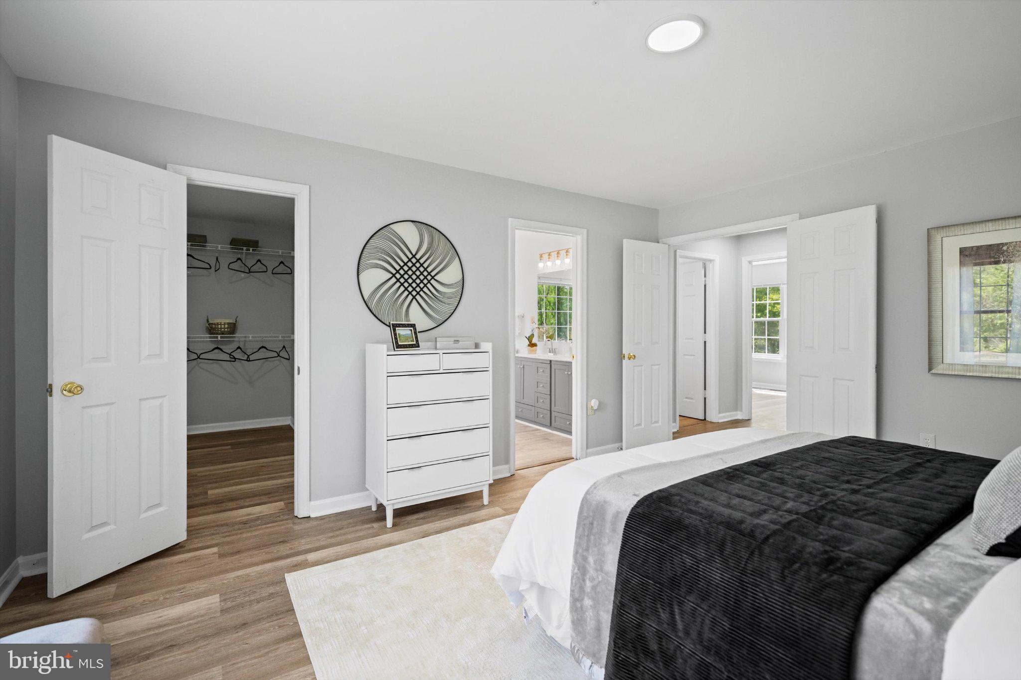 12908 Windbrook Drive Clinton, MD 20735 - Photo 19 of 67 a bedroom with a bed and a window