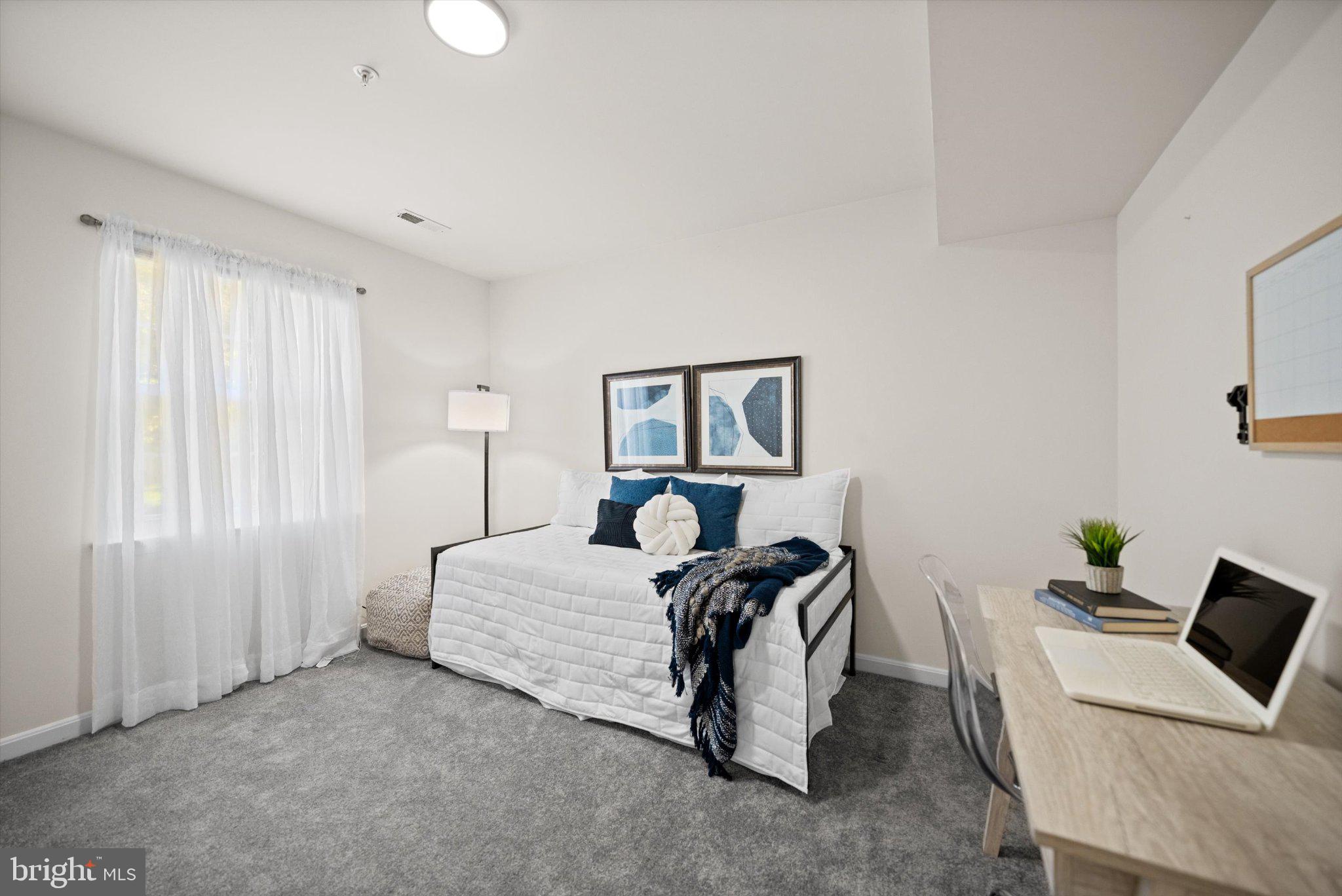 12908 Windbrook Drive Clinton, MD 20735 - Photo 23 of 67 a bed room with furniture and a window