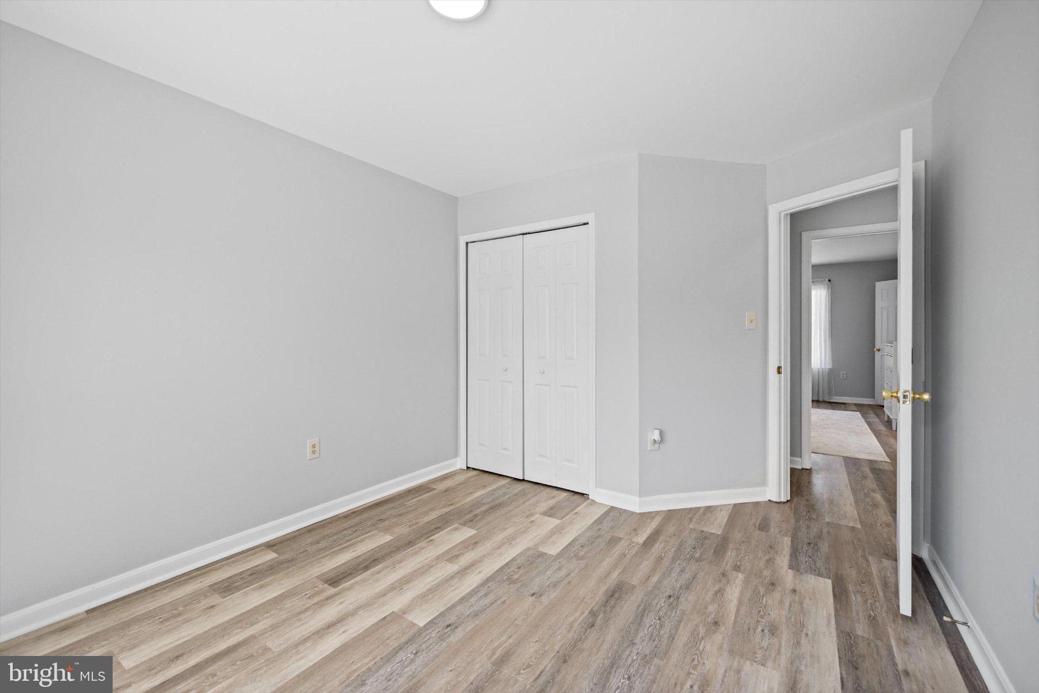 12908 Windbrook Drive Clinton, MD 20735 - Photo 29 of 67 a view of room with wooden floor