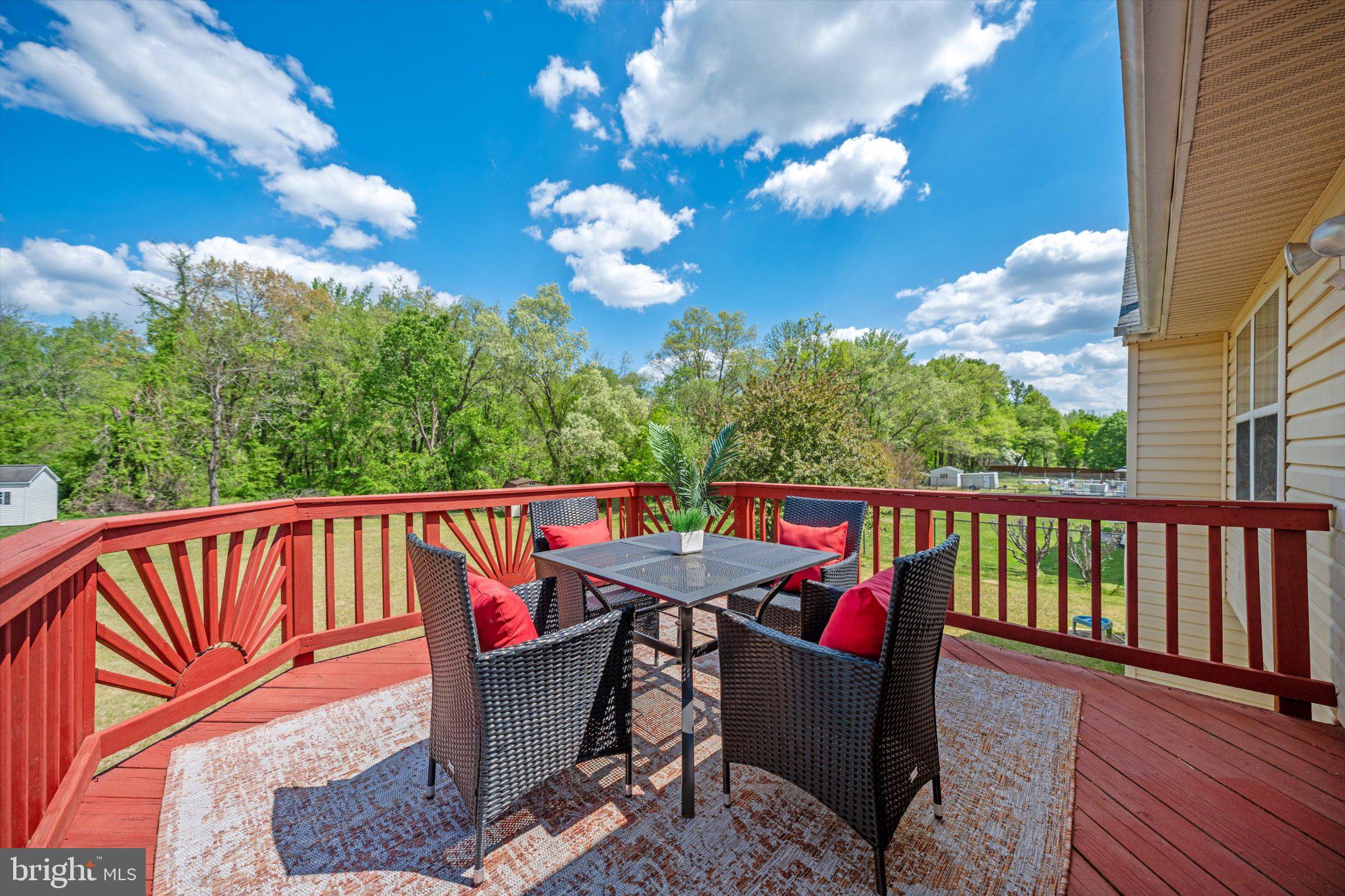 12908 Windbrook Drive Clinton, MD 20735 - Photo 31 of 67 a balcony with wooden floor and outdoor seating