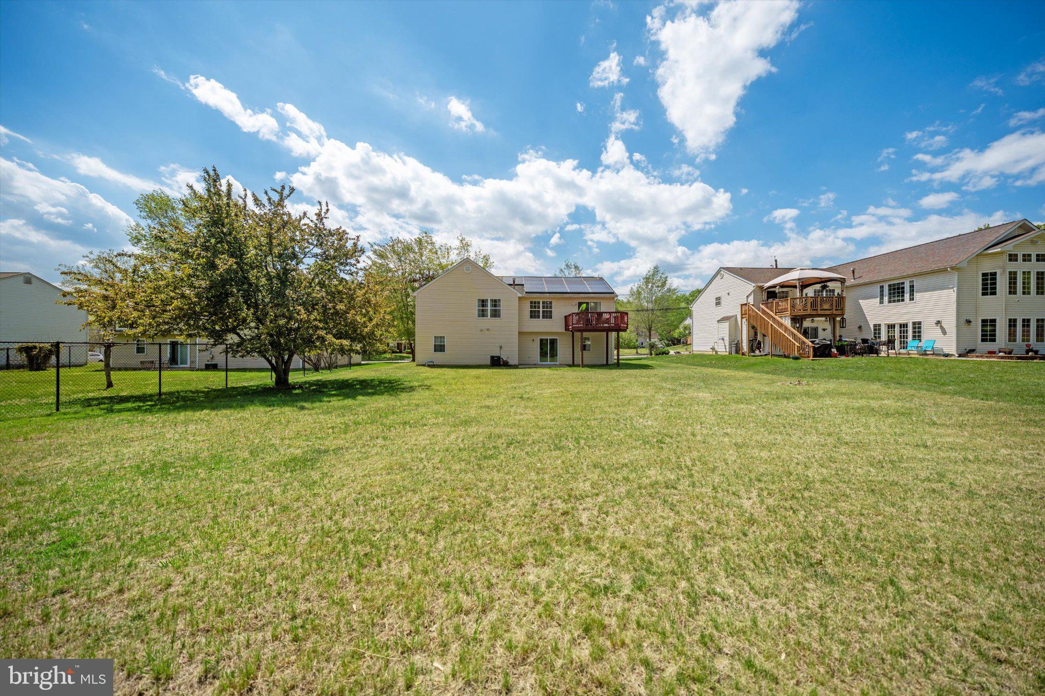 12908 Windbrook Drive Clinton, MD 20735 - Photo 35 of 67 a view of a house with a big yard