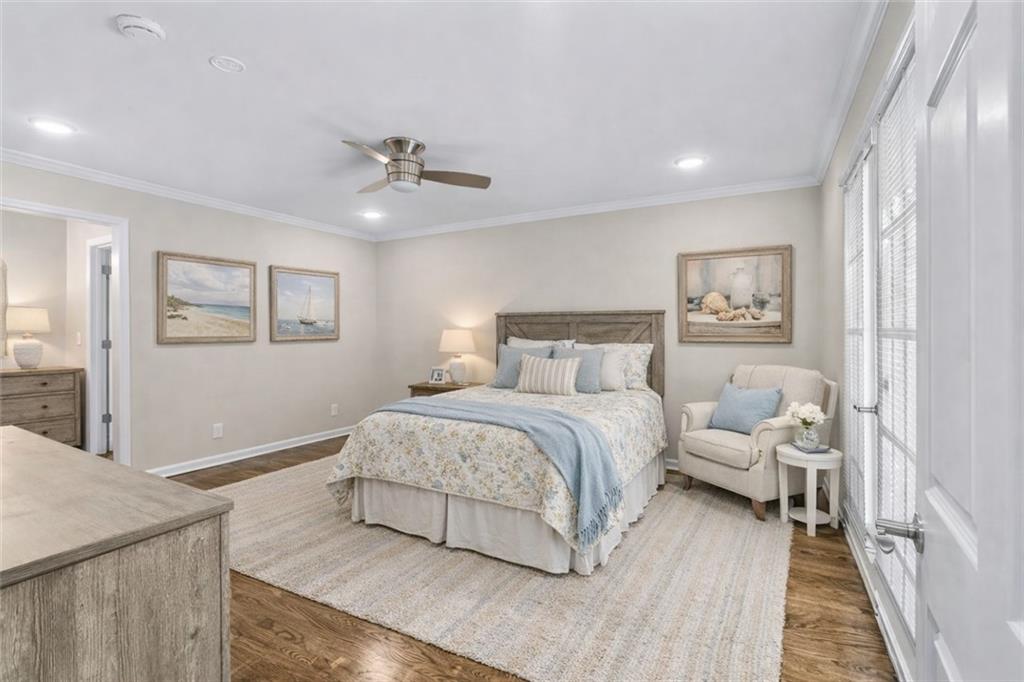 227 Rolling Wood Circle Northwest Rome, GA 30165 - Photo 11 of 31 a bedroom with a bed and a chandelier