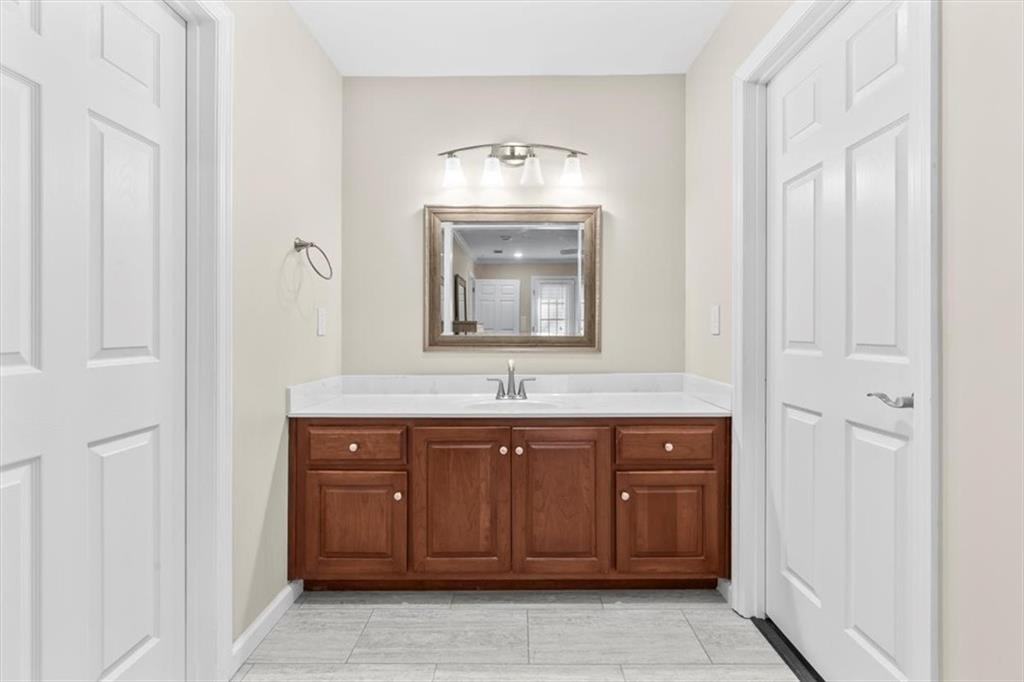 227 Rolling Wood Circle Northwest Rome, GA 30165 - Photo 13 of 31 a bathroom with a sink and a mirror