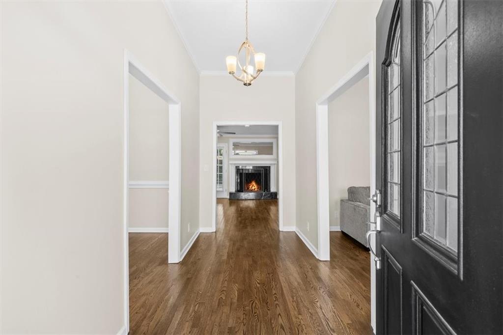227 Rolling Wood Circle Northwest Rome, GA 30165 - Photo 2 of 31 a view of a hallway with wooden floor and staircase