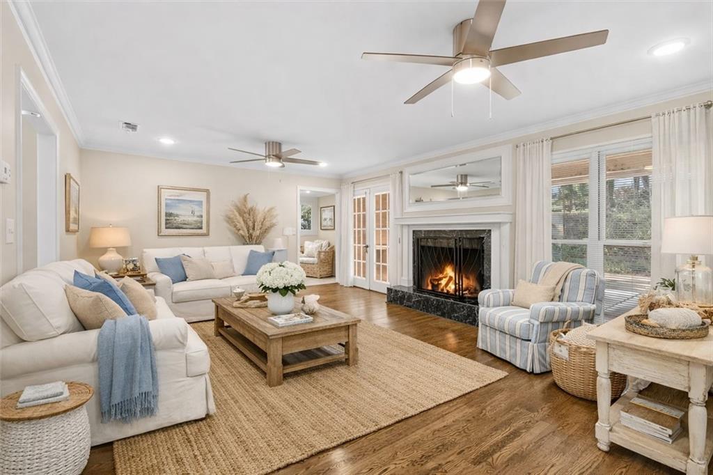 227 Rolling Wood Circle Northwest Rome, GA 30165 - Photo 10 of 31 a living room with furniture ceiling fan and a fireplace