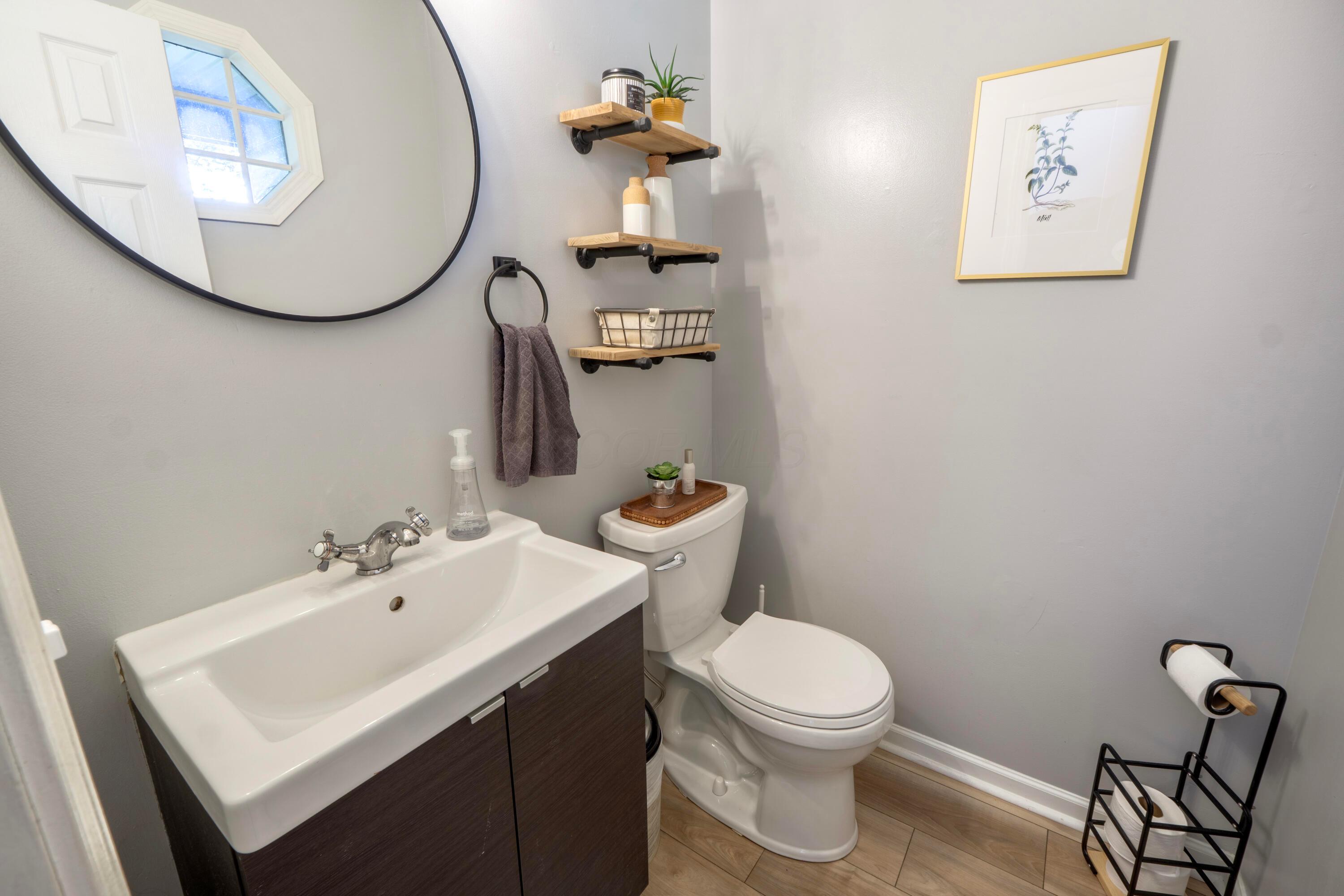 160 Kettering Bend Delaware, OH 43015 - Photo 18 of 49 Lovely updated half bathroom has an octagonal window!