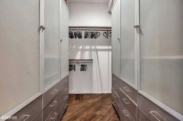 a view of hallway with wooden floor