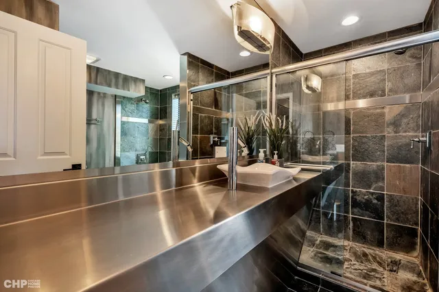 a room with table chairs and a large window