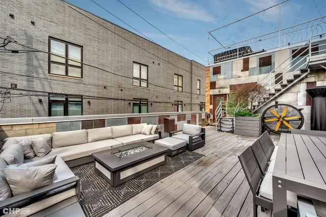 a living room with furniture fireplace and a table