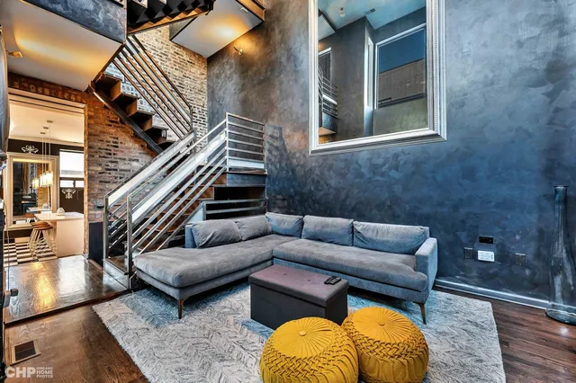 a living room with furniture and a rug