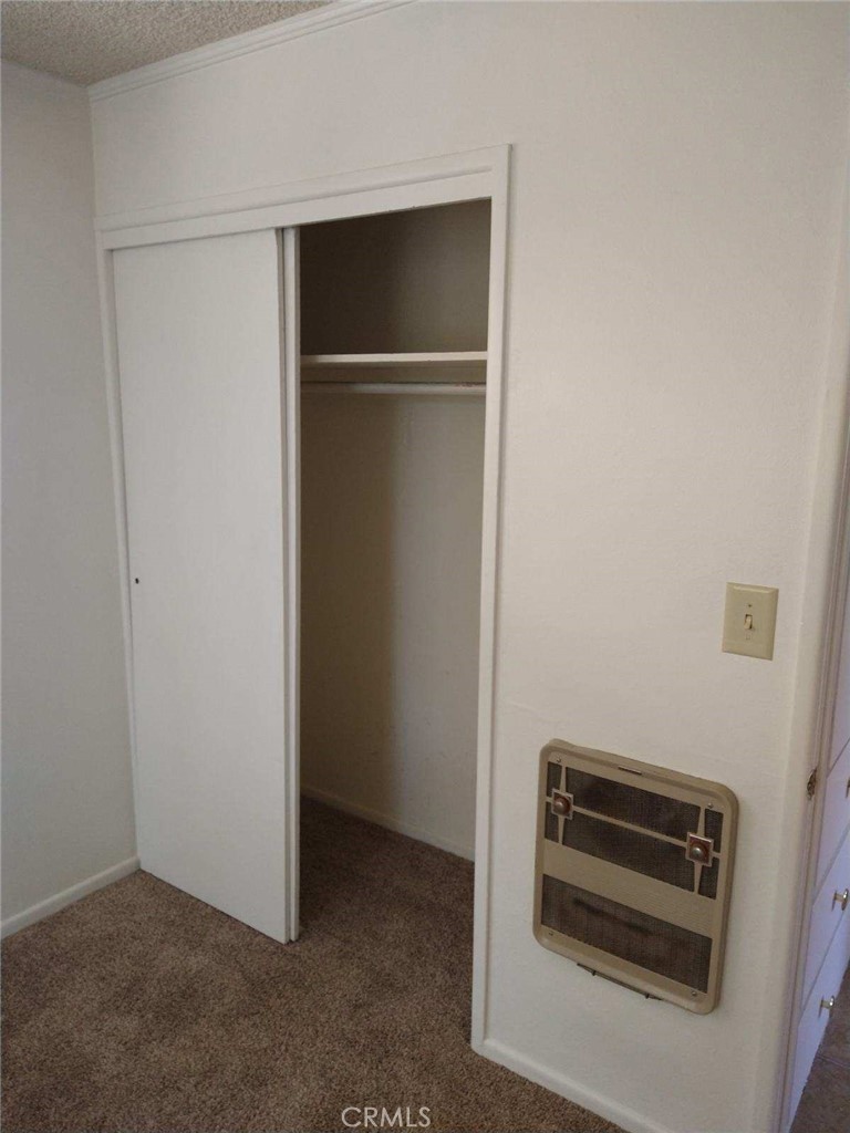 21988 Mojave River Road Cedarpines Park, CA 92322 - Photo 5 of 10 a view of hallway with washer and dryer