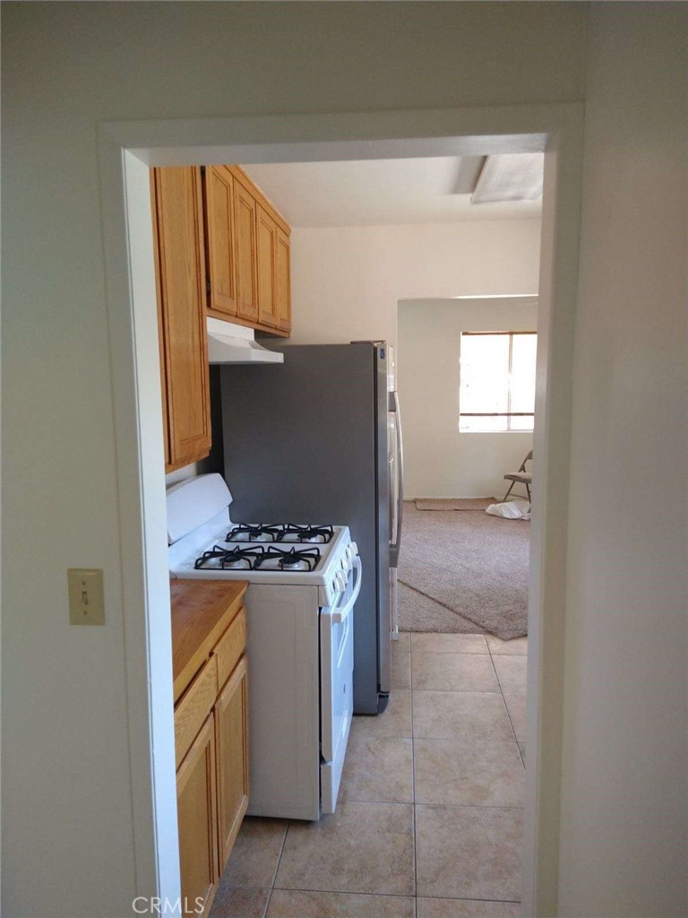 21988 Mojave River Road Cedarpines Park, CA 92322 - Photo 7 of 10 a kitchen with window and washer
