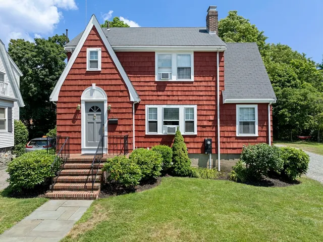 front view of a house with a yard
