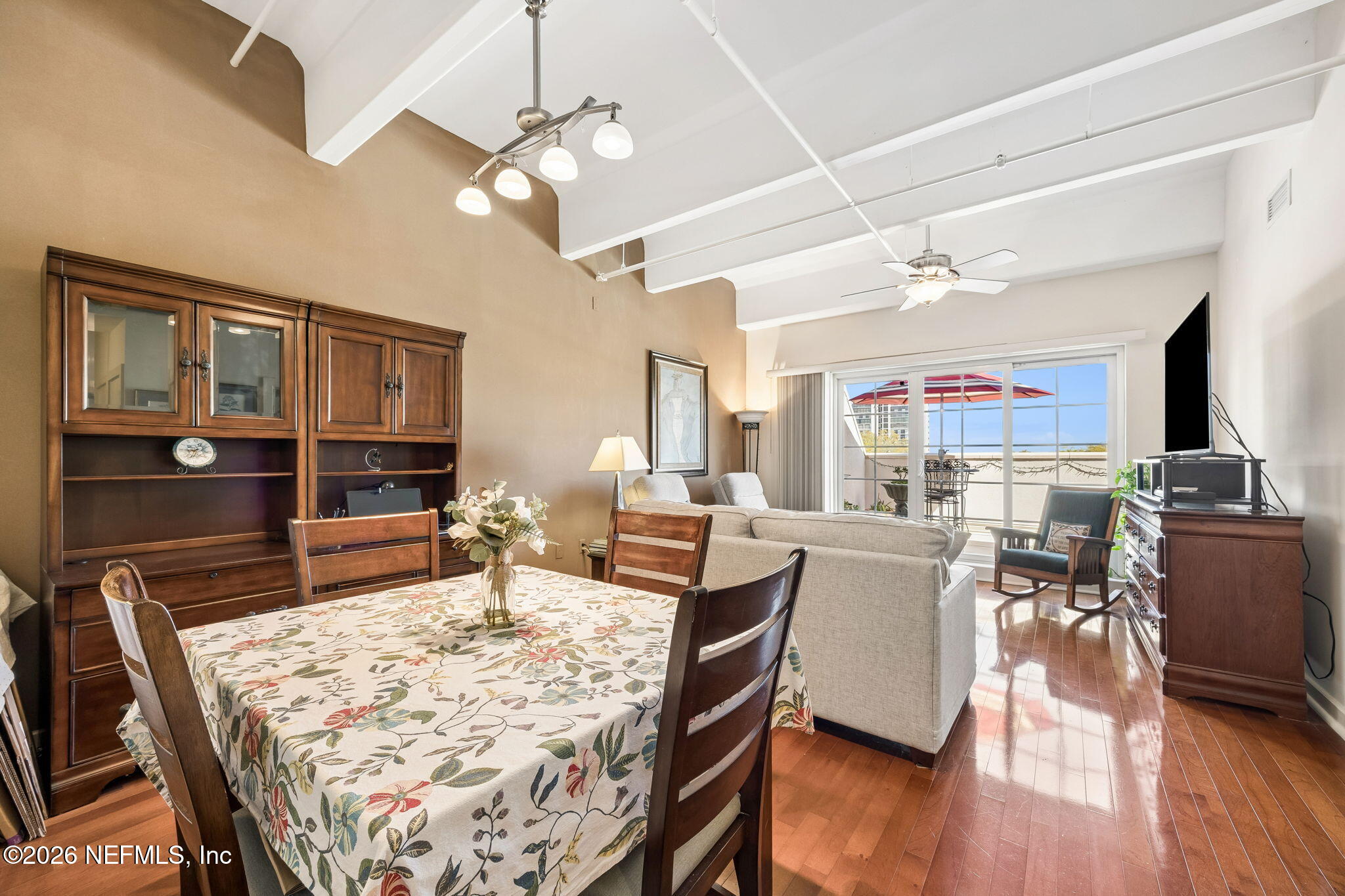 1661 Riverside Avenue, Unit 410 Jacksonville, FL 32204 - Photo 11 of 54 a living room with furniture a wooden floor and chandelier