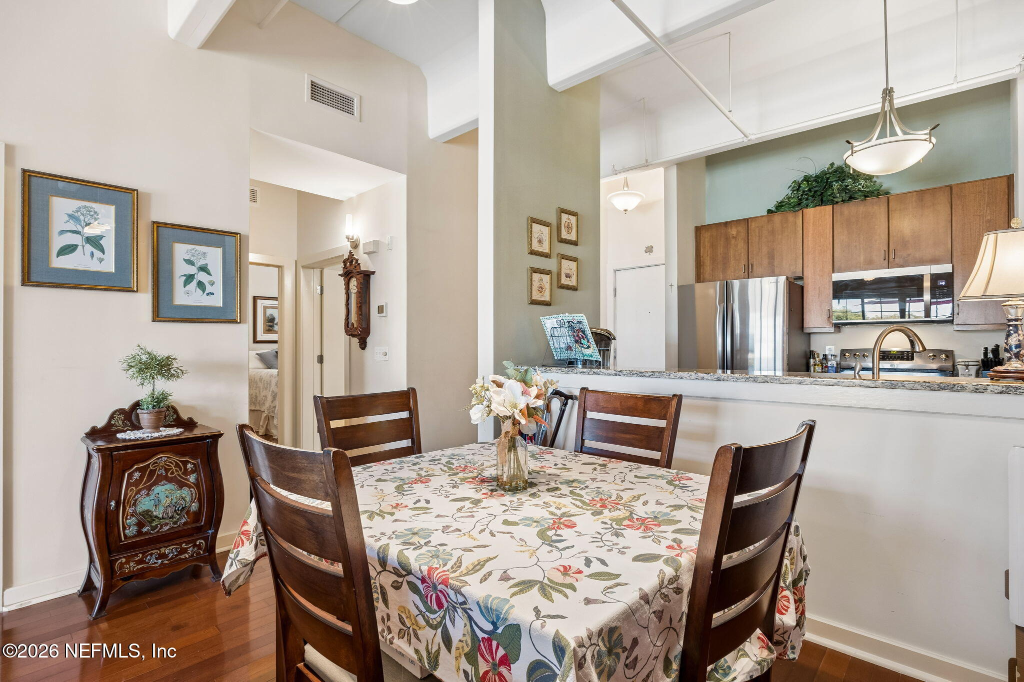 1661 Riverside Avenue, Unit 410 Jacksonville, FL 32204 - Photo 12 of 54 a dining room with furniture and wooden floor