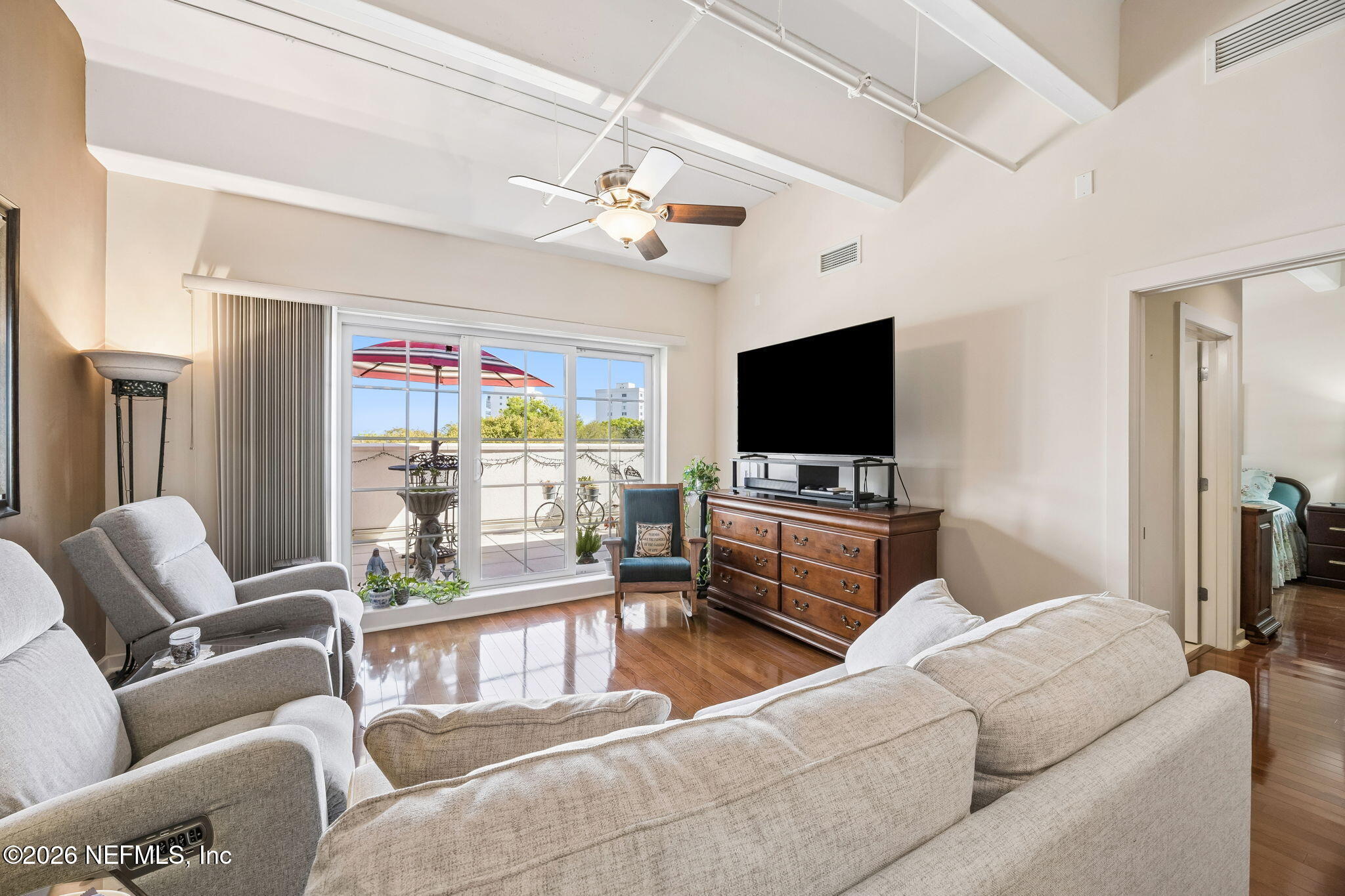 1661 Riverside Avenue, Unit 410 Jacksonville, FL 32204 - Photo 14 of 54 a living room with furniture and a flat screen tv