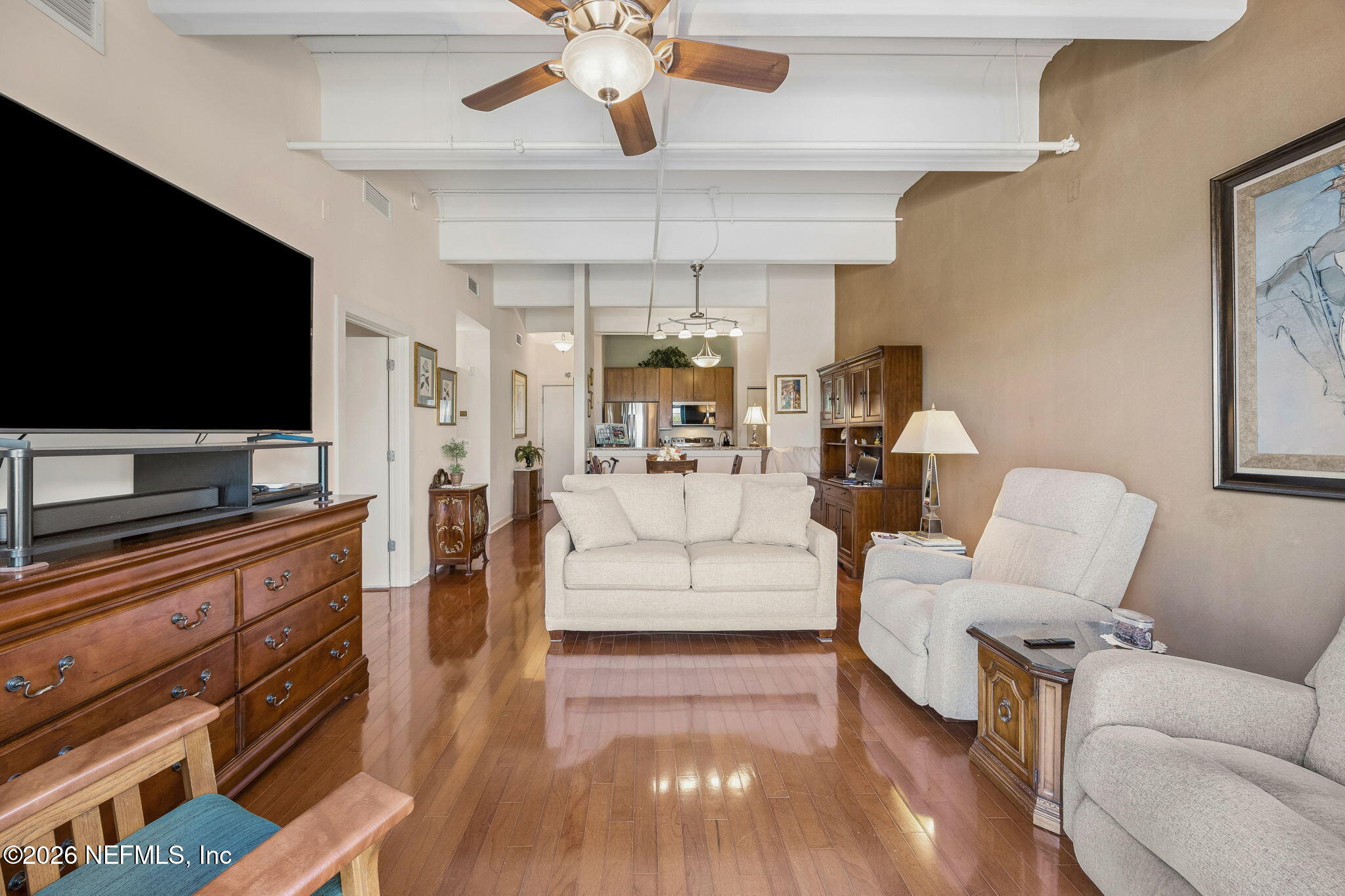 1661 Riverside Avenue, Unit 410 Jacksonville, FL 32204 - Photo 15 of 54 a living room with furniture and a flat screen tv
