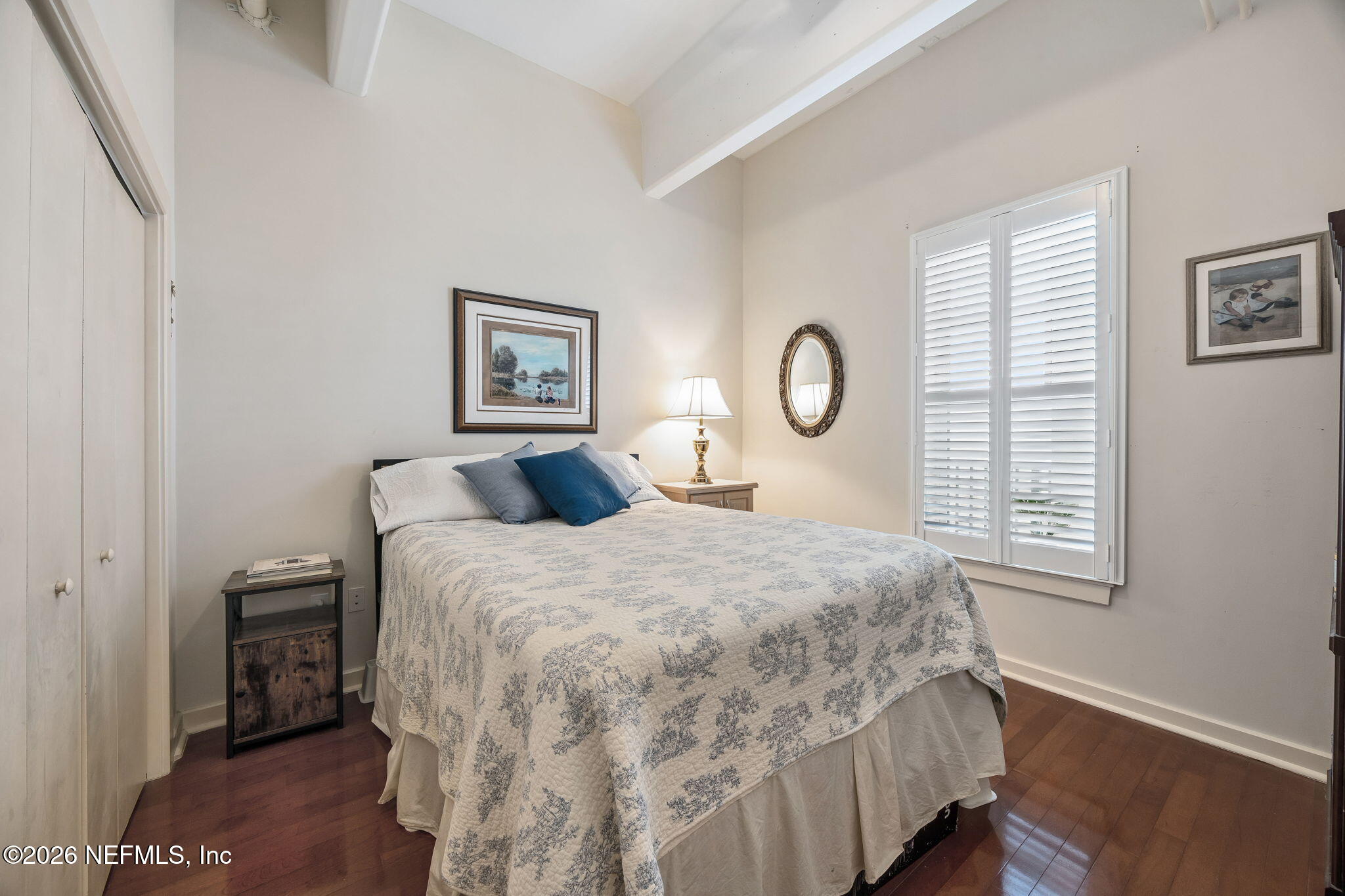 1661 Riverside Avenue, Unit 410 Jacksonville, FL 32204 - Photo 19 of 54 a bedroom with a bed and a window