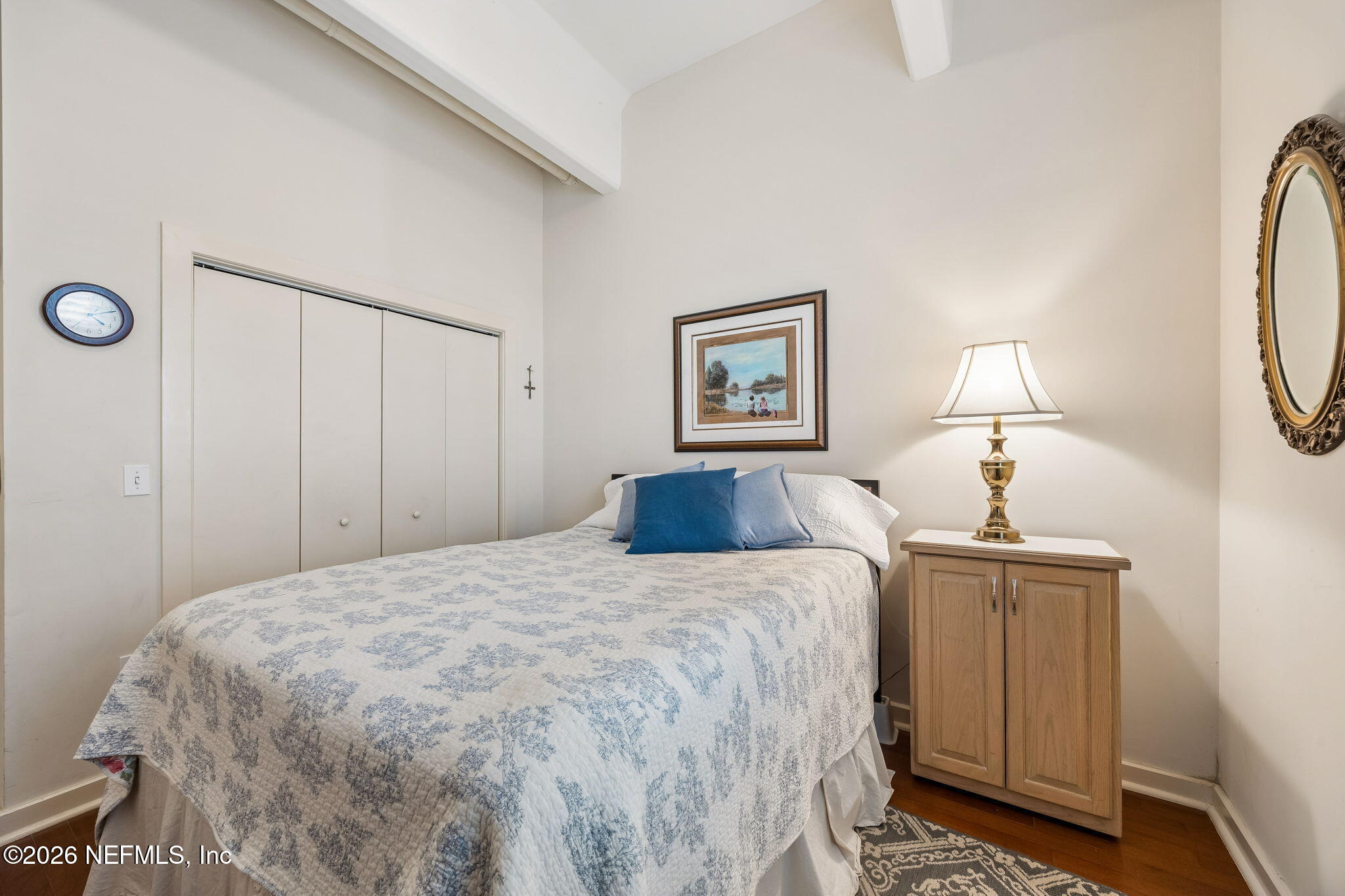 1661 Riverside Avenue, Unit 410 Jacksonville, FL 32204 - Photo 20 of 54 a bedroom with a bed and a mirror