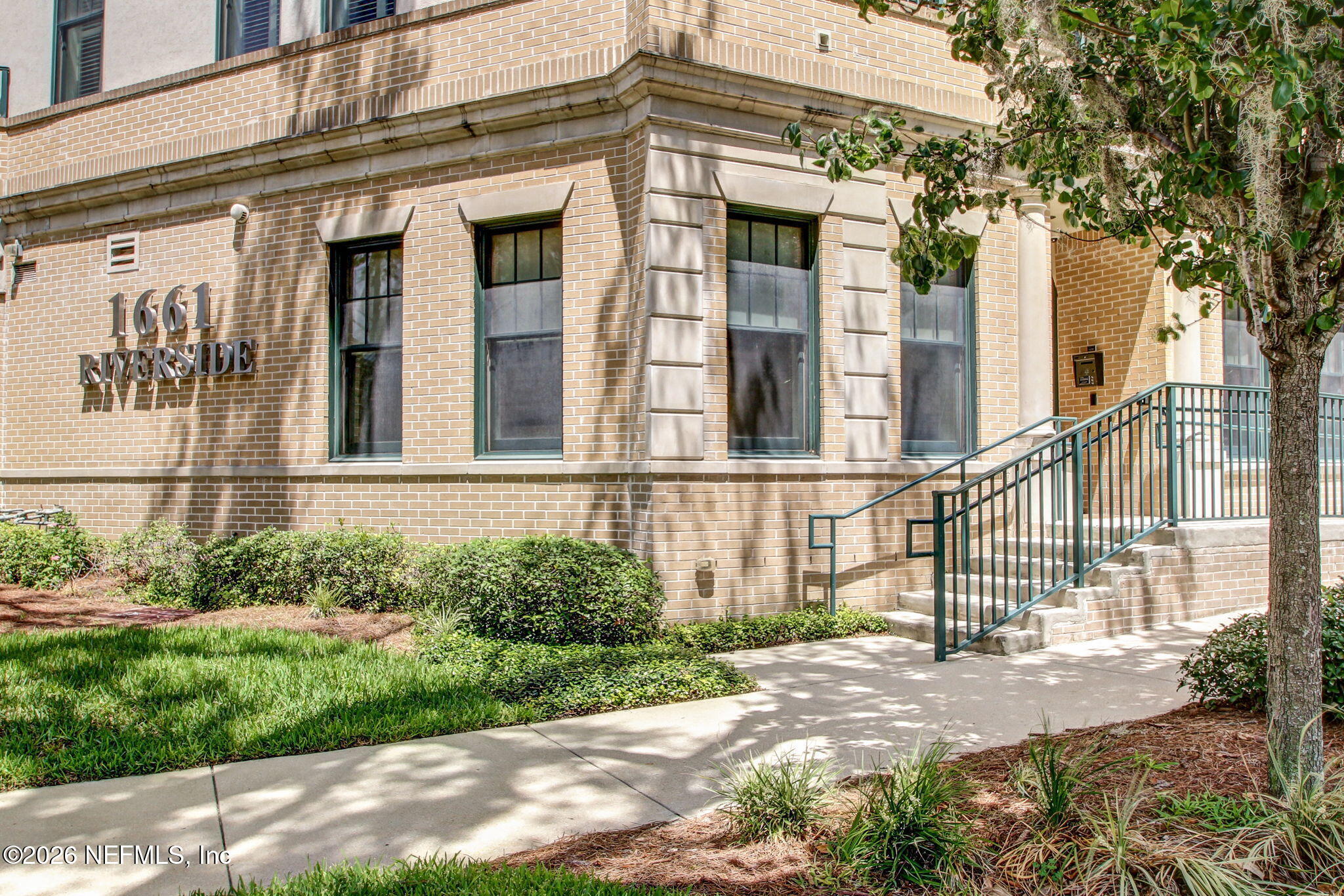 1661 Riverside Avenue, Unit 410 Jacksonville, FL 32204 - Photo 2 of 54 a view of a house with a small yard and plants