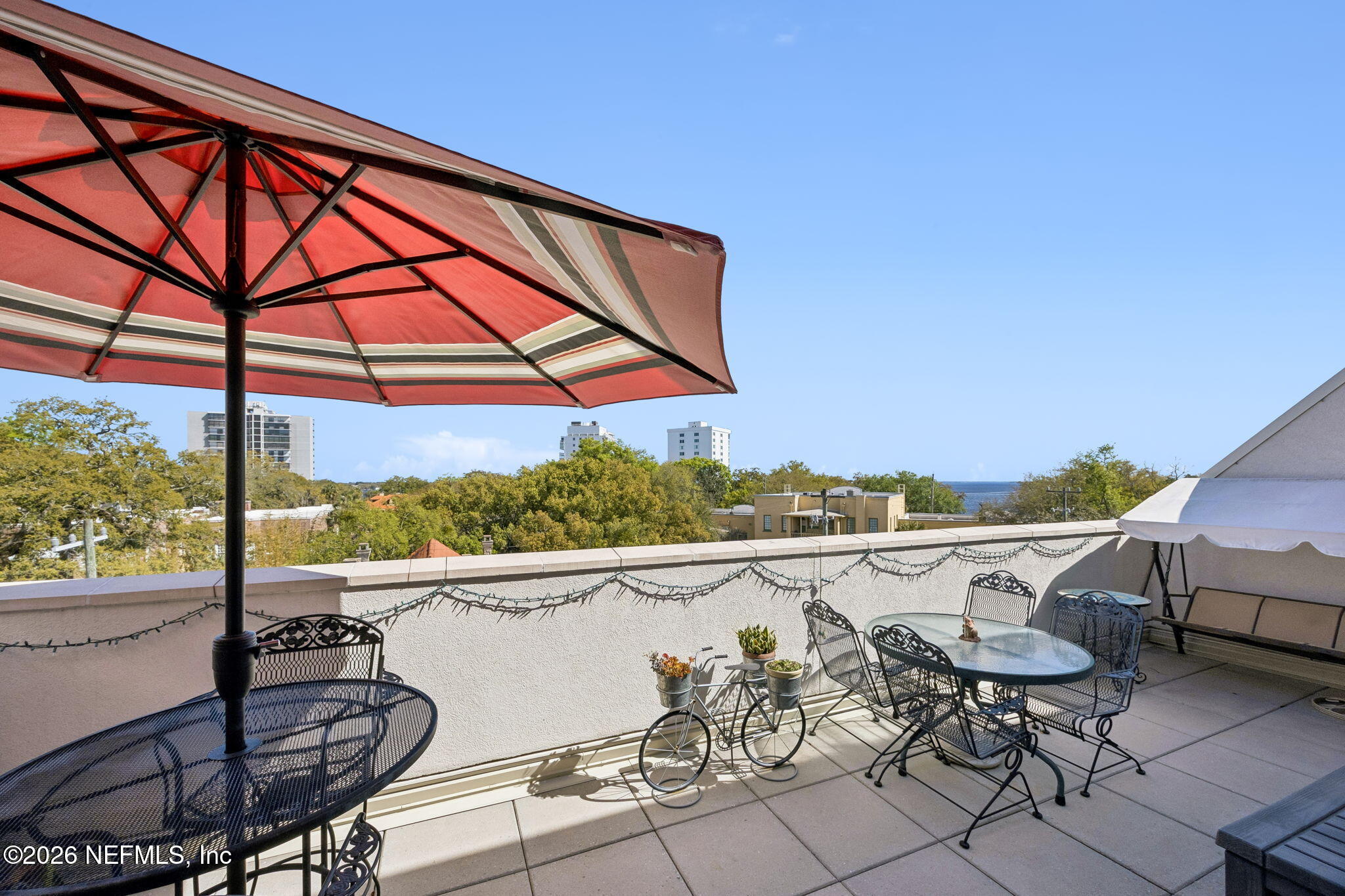 1661 Riverside Avenue, Unit 410 Jacksonville, FL 32204 - Photo 22 of 54 a view of a chairs and table in patio