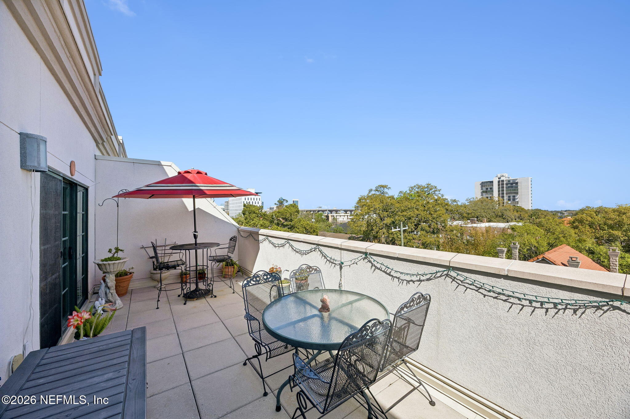 1661 Riverside Avenue, Unit 410 Jacksonville, FL 32204 - Photo 23 of 54 a view of a balcony dining table and chairs
