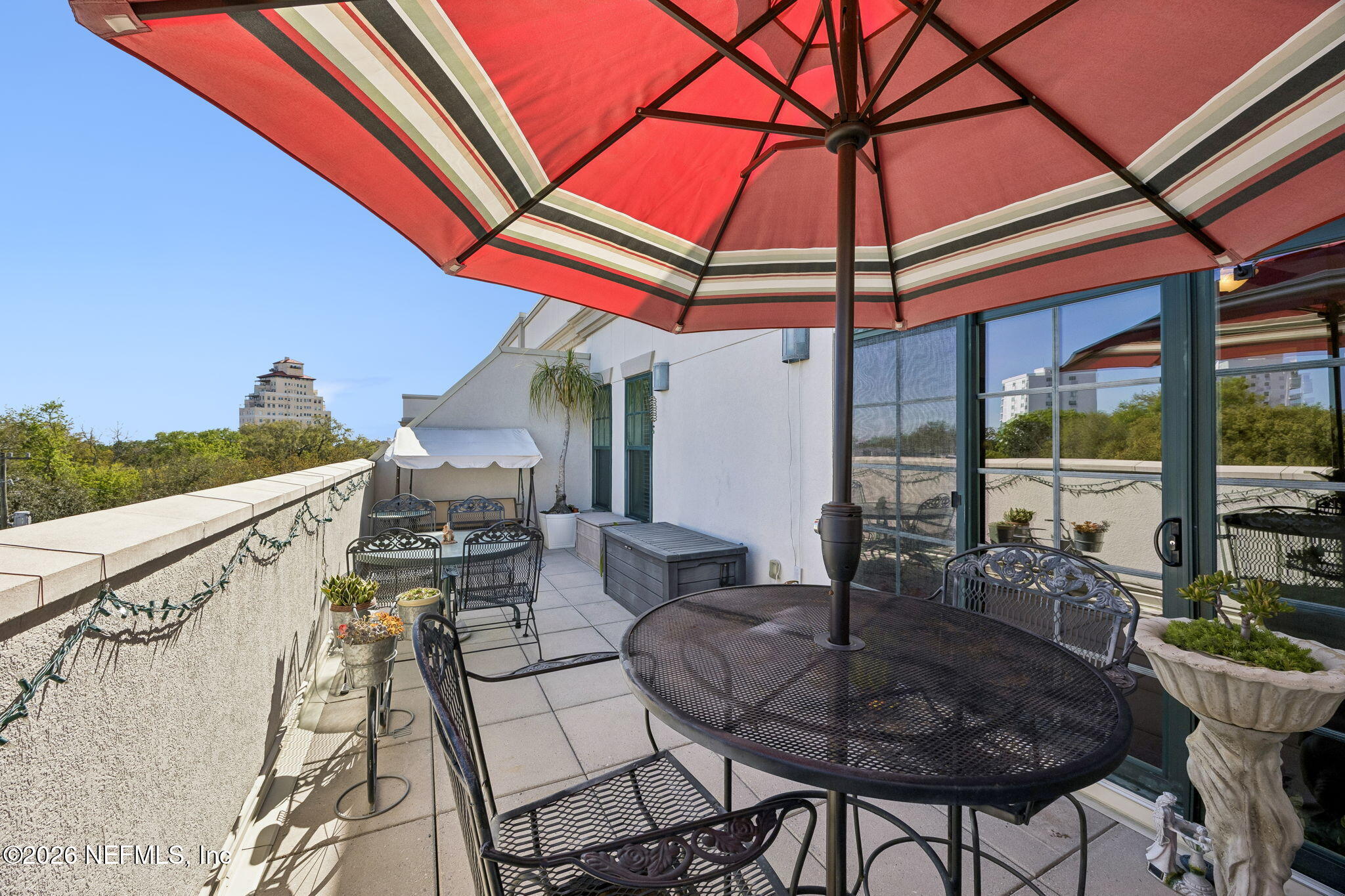 1661 Riverside Avenue, Unit 410 Jacksonville, FL 32204 - Photo 25 of 54 a dining room with furniture and a floor to ceiling window