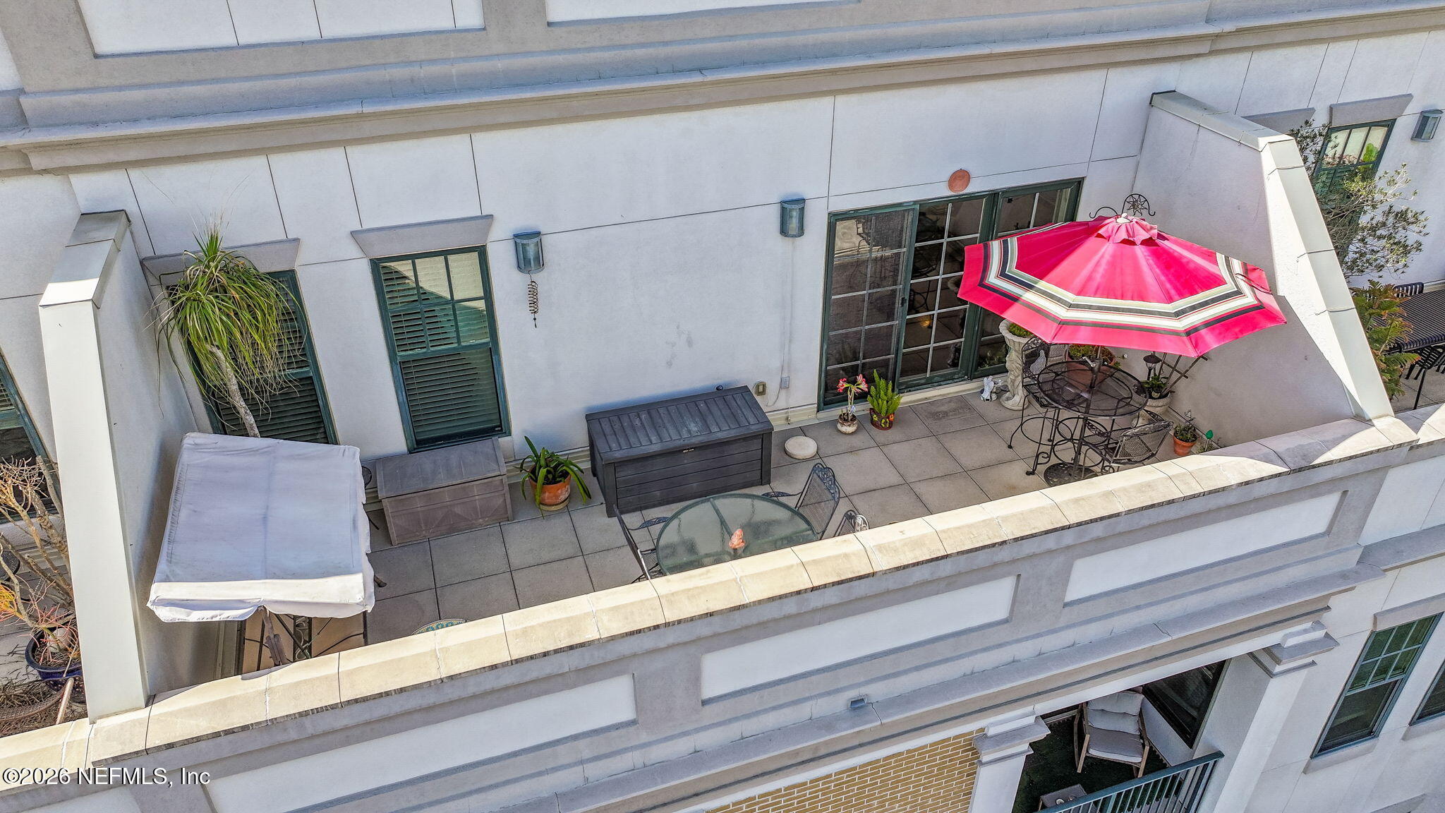 1661 Riverside Avenue, Unit 410 Jacksonville, FL 32204 - Photo 29 of 54 a view of a living room with furniture and a potted plant