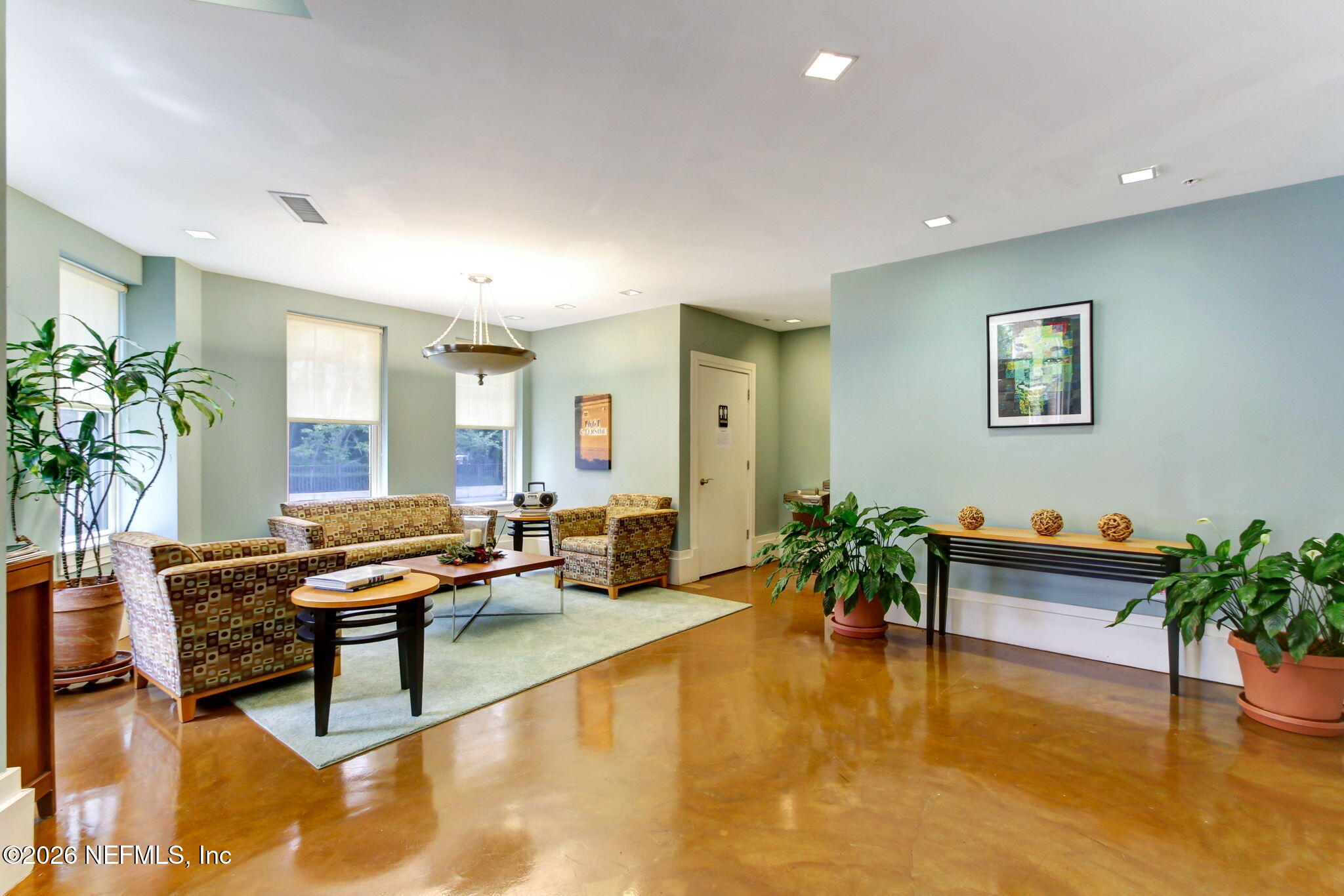 1661 Riverside Avenue, Unit 410 Jacksonville, FL 32204 - Photo 3 of 54 a living room with furniture and flowers