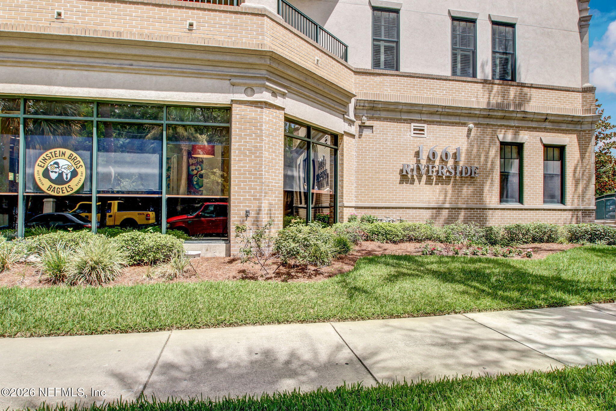 1661 Riverside Avenue, Unit 410 Jacksonville, FL 32204 - Photo 40 of 54 a front view of a building with garden