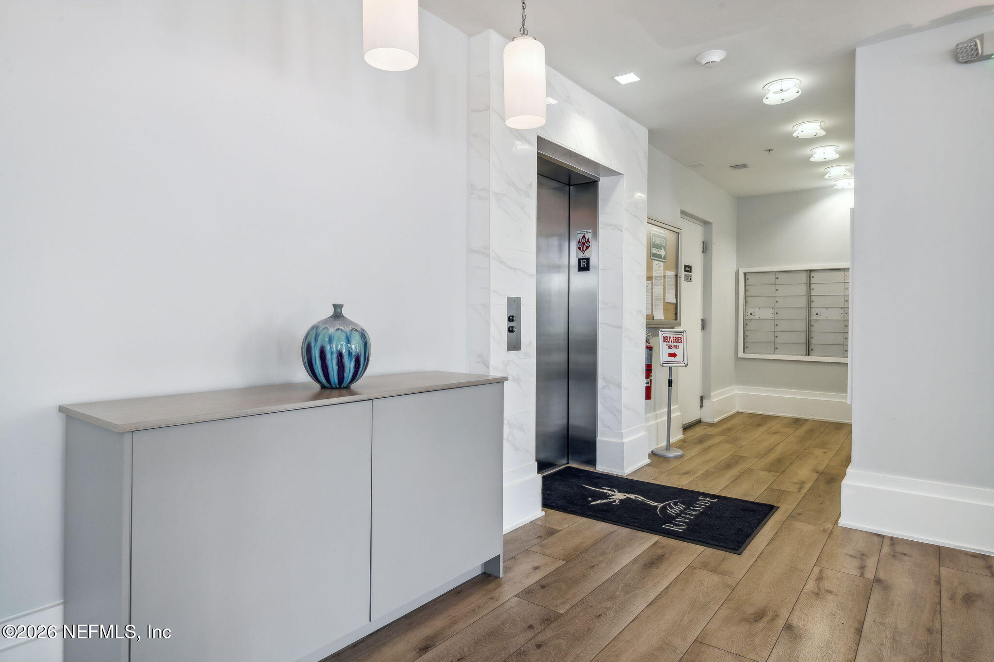 1661 Riverside Avenue, Unit 410 Jacksonville, FL 32204 - Photo 4 of 54 a view of kitchen with stainless steel appliances cabinets and wooden floor