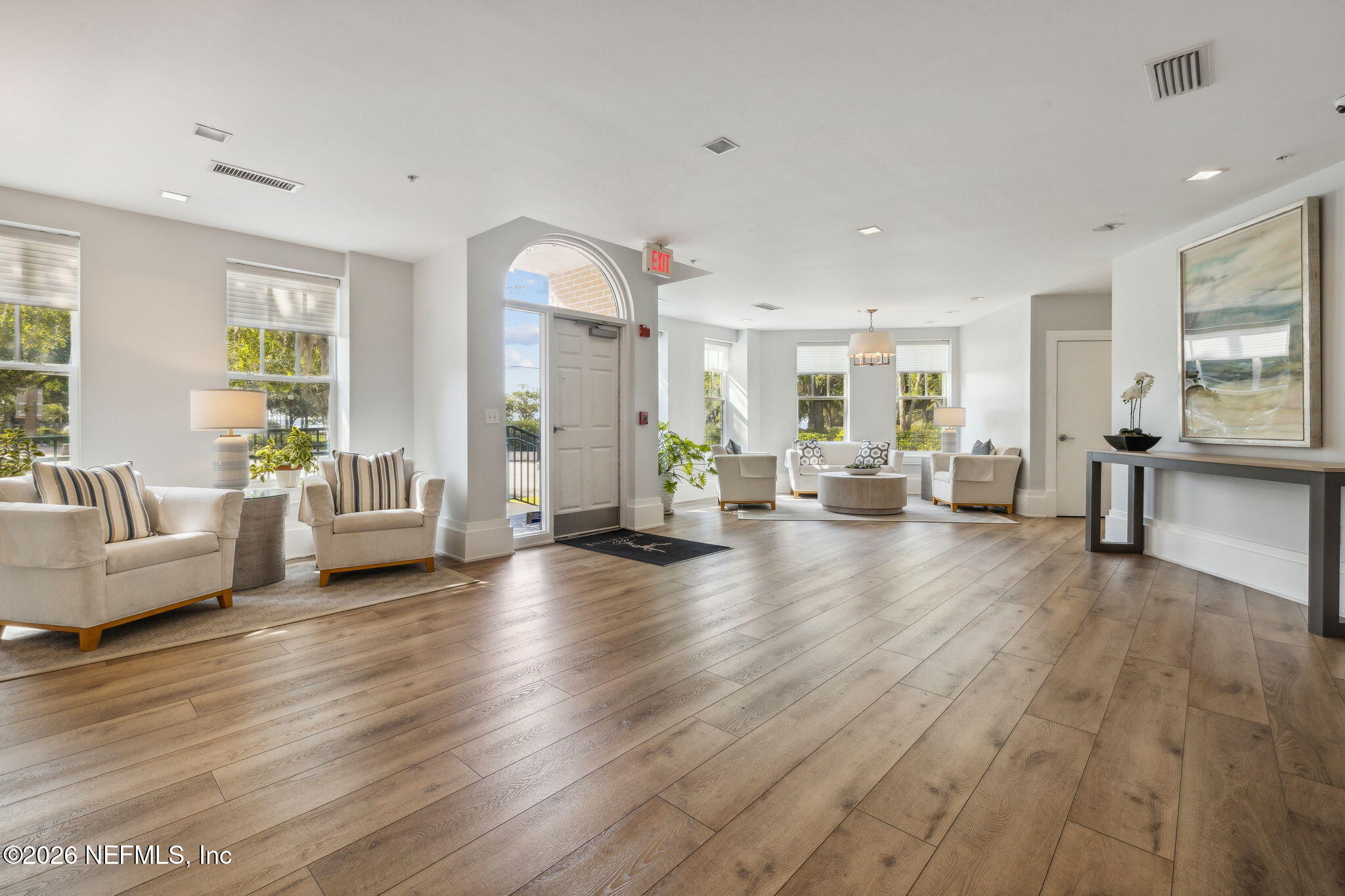 1661 Riverside Avenue, Unit 410 Jacksonville, FL 32204 - Photo 42 of 54 a living room with furniture and a wooden floor