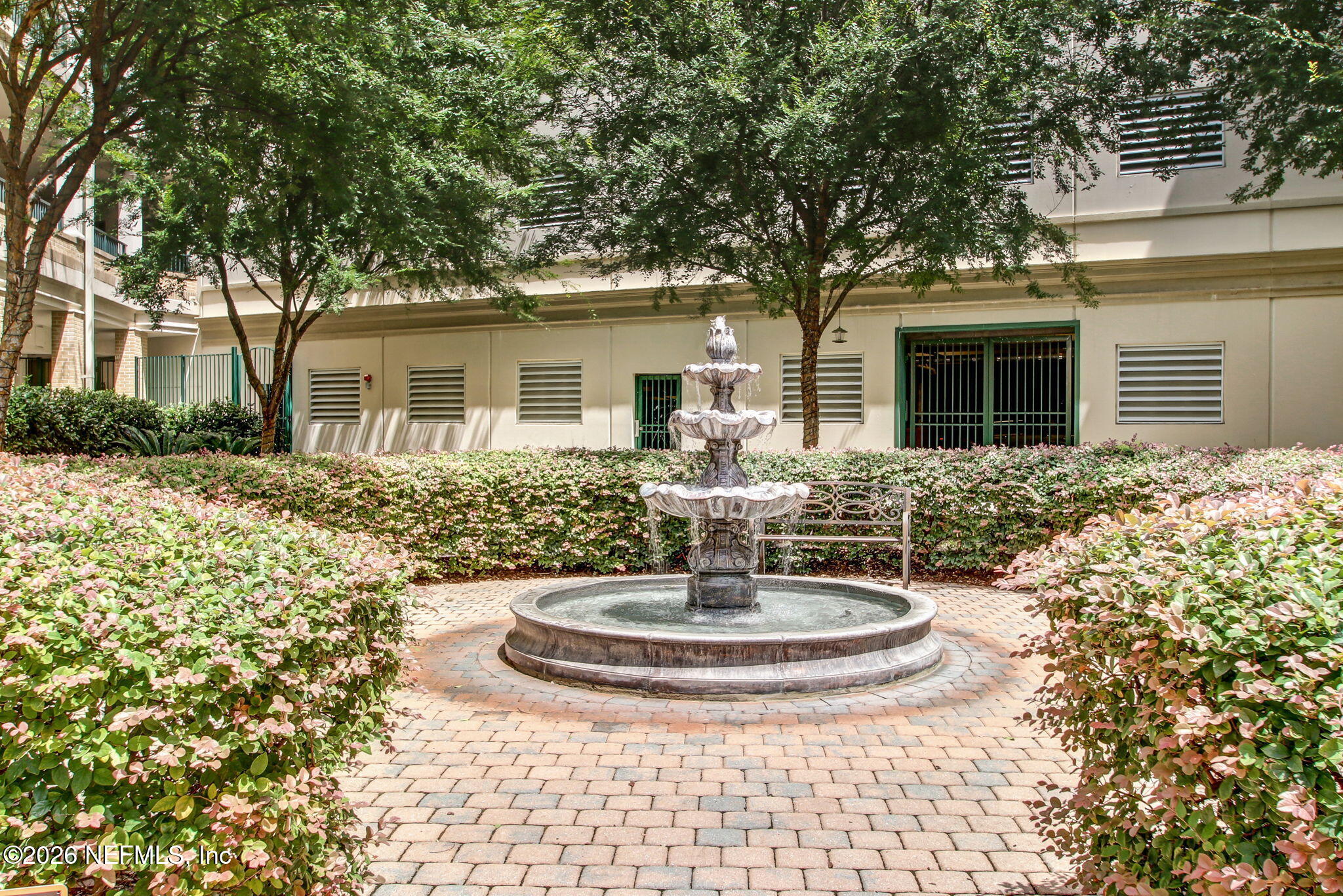 1661 Riverside Avenue, Unit 410 Jacksonville, FL 32204 - Photo 46 of 54 a view of a house with a fountain and a tree
