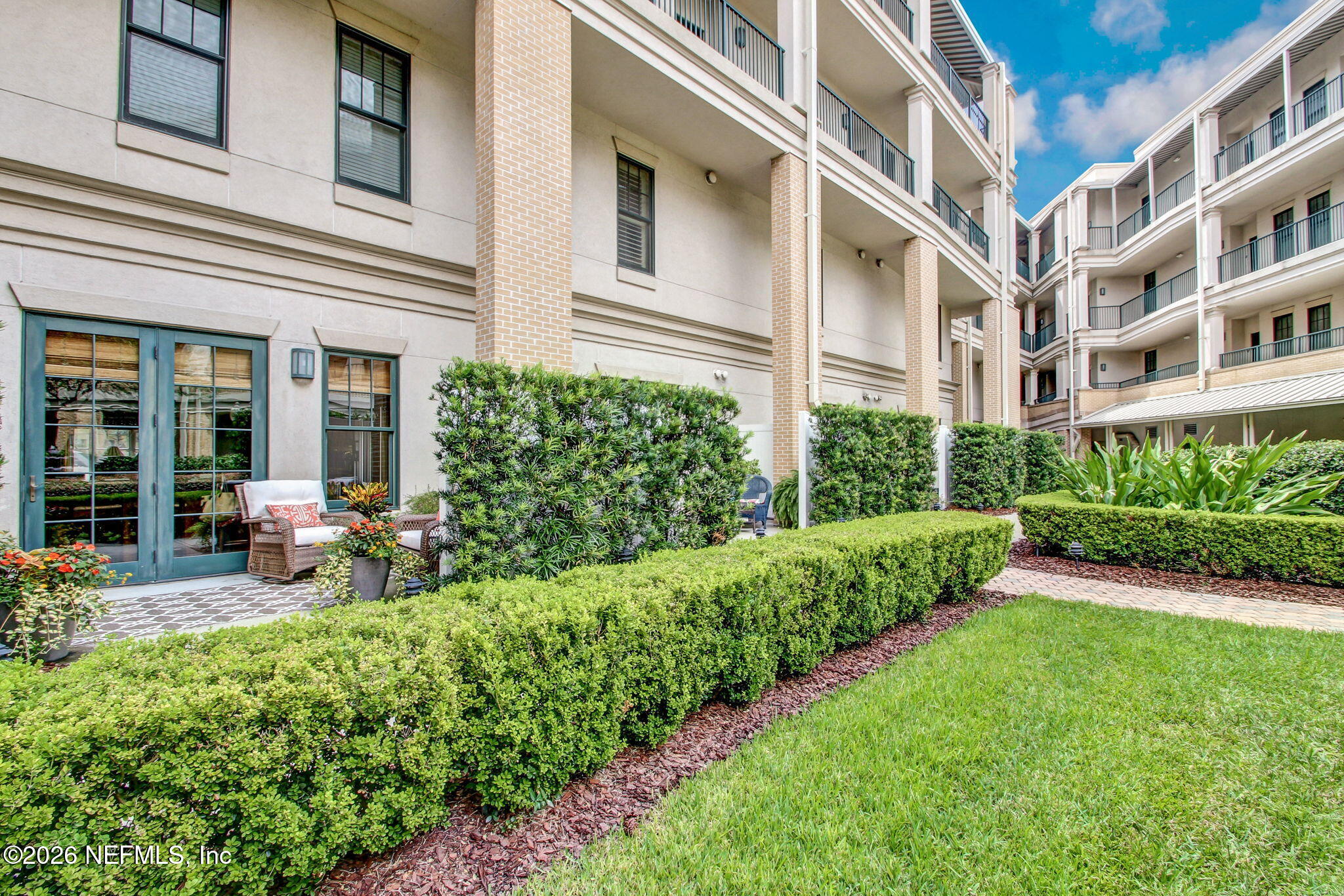 1661 Riverside Avenue, Unit 410 Jacksonville, FL 32204 - Photo 47 of 54 a view of a building with garden and porch