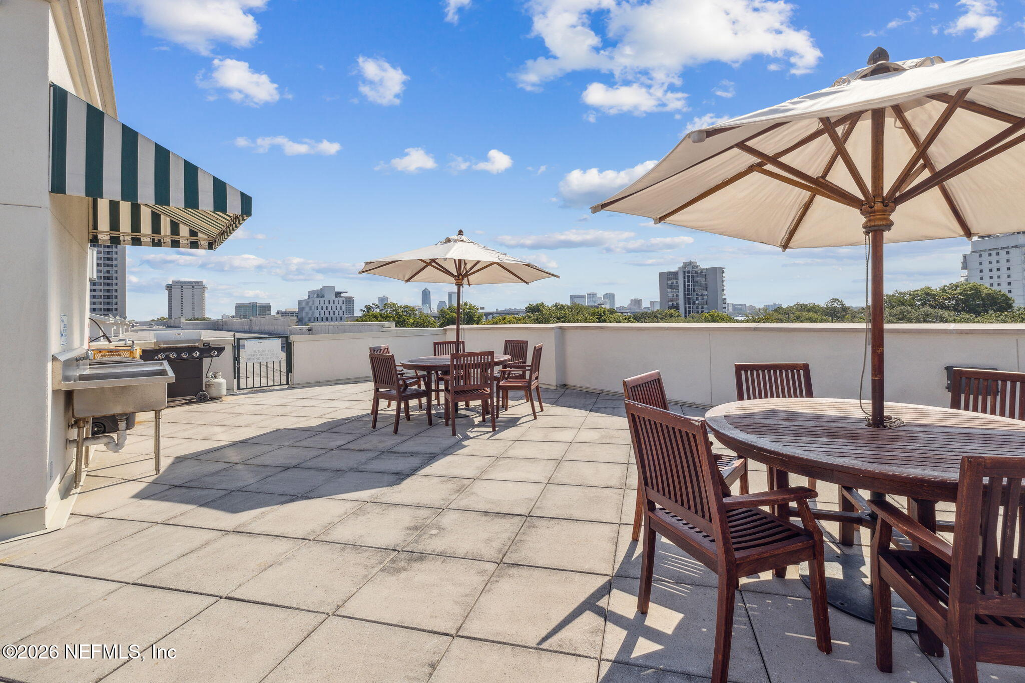 1661 Riverside Avenue, Unit 410 Jacksonville, FL 32204 - Photo 49 of 54 a view of a dinning table and chairs in the patio