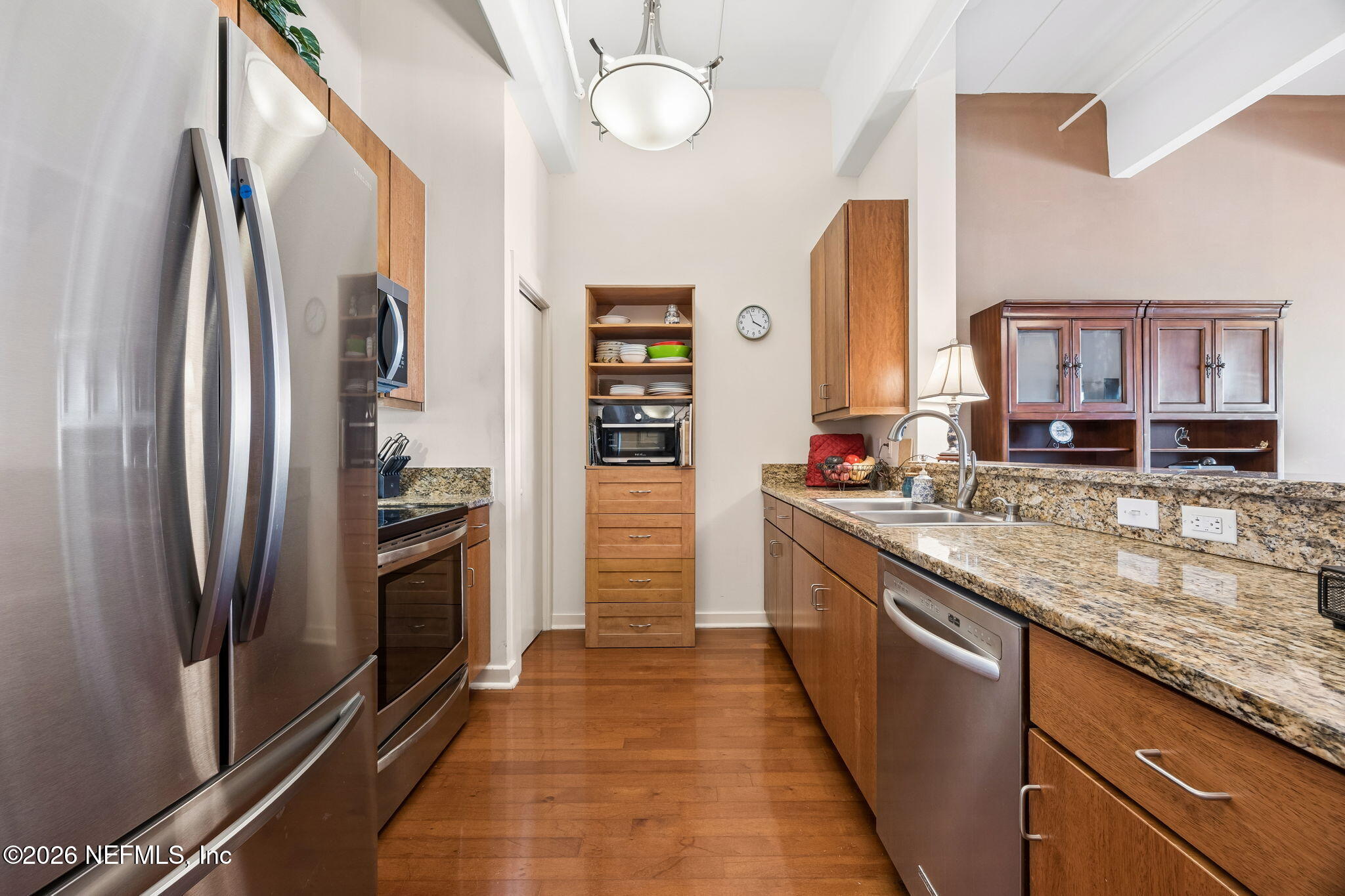 1661 Riverside Avenue, Unit 410 Jacksonville, FL 32204 - Photo 7 of 54 a kitchen with stainless steel appliances granite countertop a refrigerator and a sink